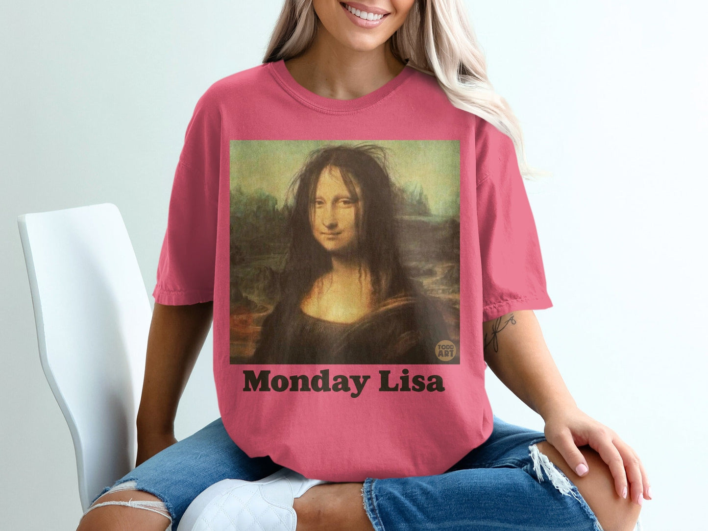 Pink t-shirt with Mona Lisa artwork titled "Monday Lisa"