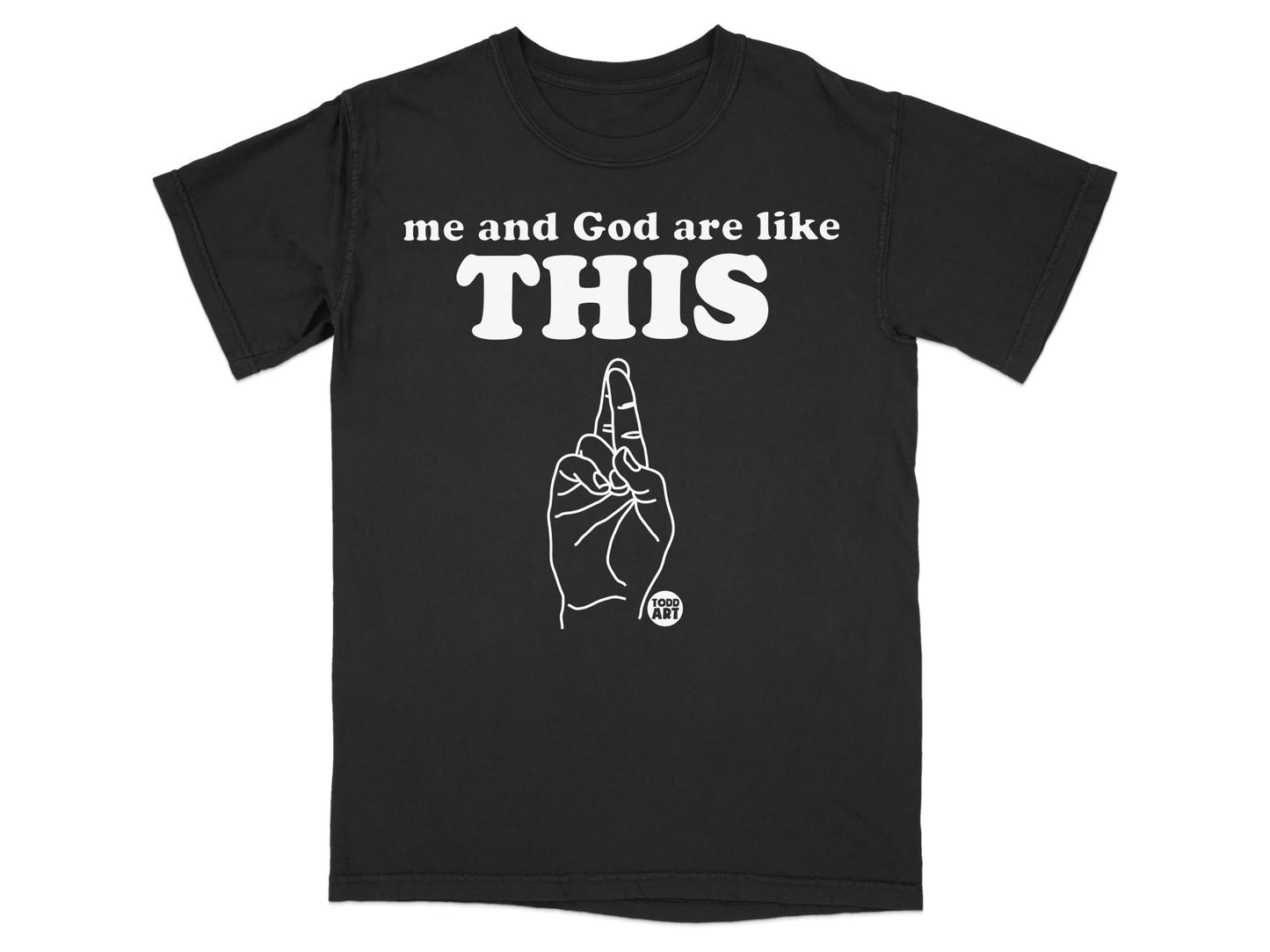Black t-shirt with "me and God are like THIS" and a hand gesture.