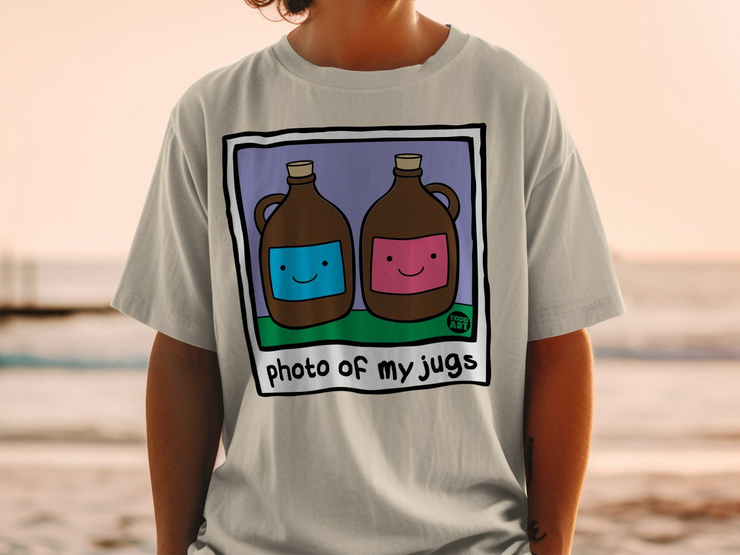 Two cartoon jugs, one blue and one pink, on a t-shirt.
