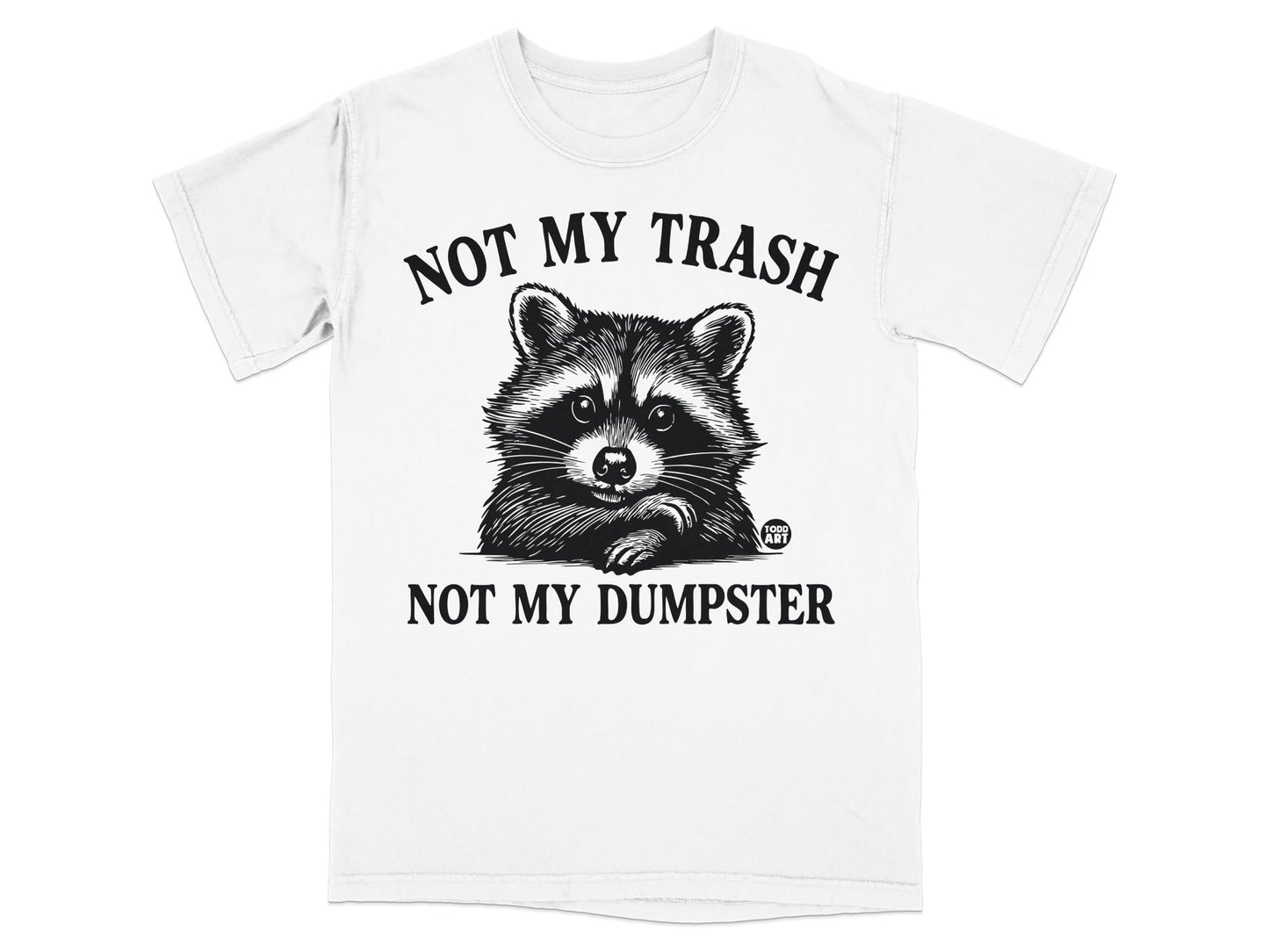 White t-shirt with a raccoon illustration and text "NOT MY TRASH NOT MY DUMPSTER".