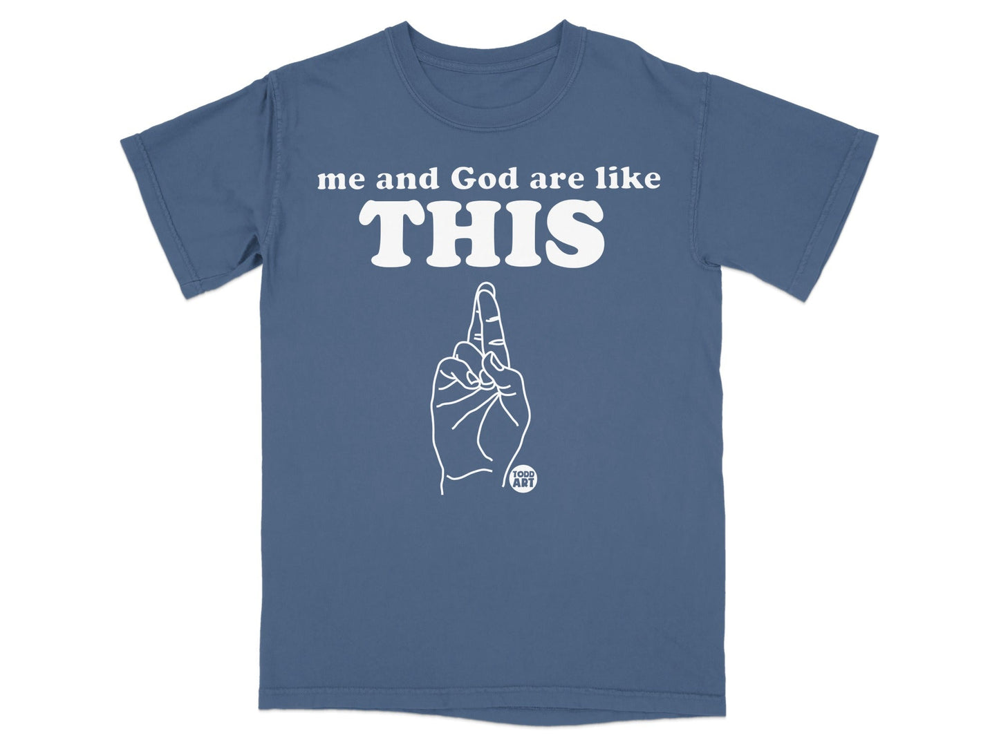 Blue t-shirt with white text "me and God are like THIS" and a hand pointing up.