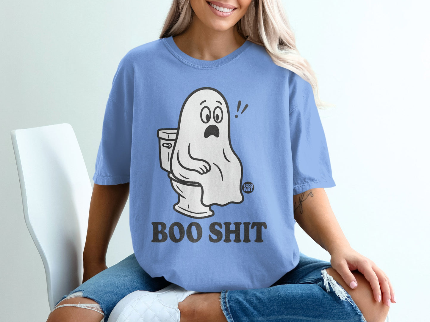 Blue t-shirt with "Boo Shit" text and a startled ghost sitting on a toilet.