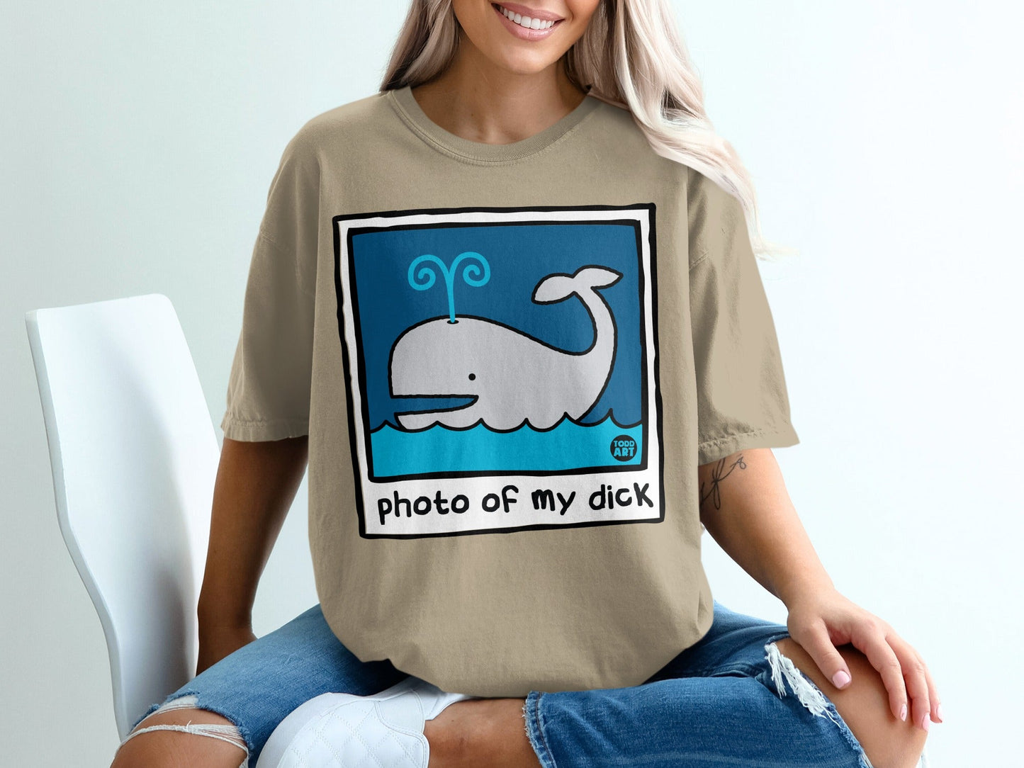 Illustration of a whale spouting water with text that says "photo of my dick."