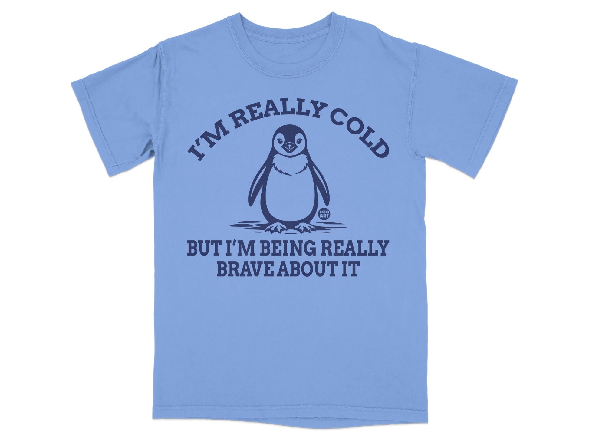Blue t-shirt with a penguin graphic and "I'M REALLY COLD BUT I'M BEING REALLY BRAVE ABOUT IT" text.