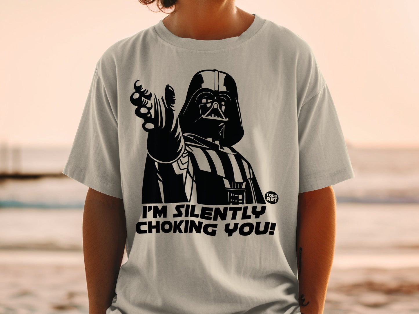 Darth Vader on t-shirt pointing, "I'M SILENTLY CHOKING YOU!"