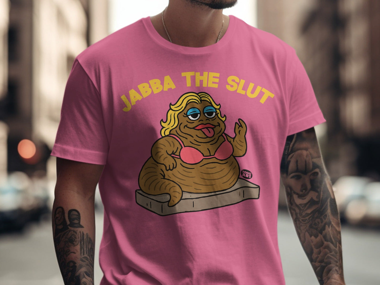 Pink t-shirt with cartoon Jabba the Hutt character in a pink bra.