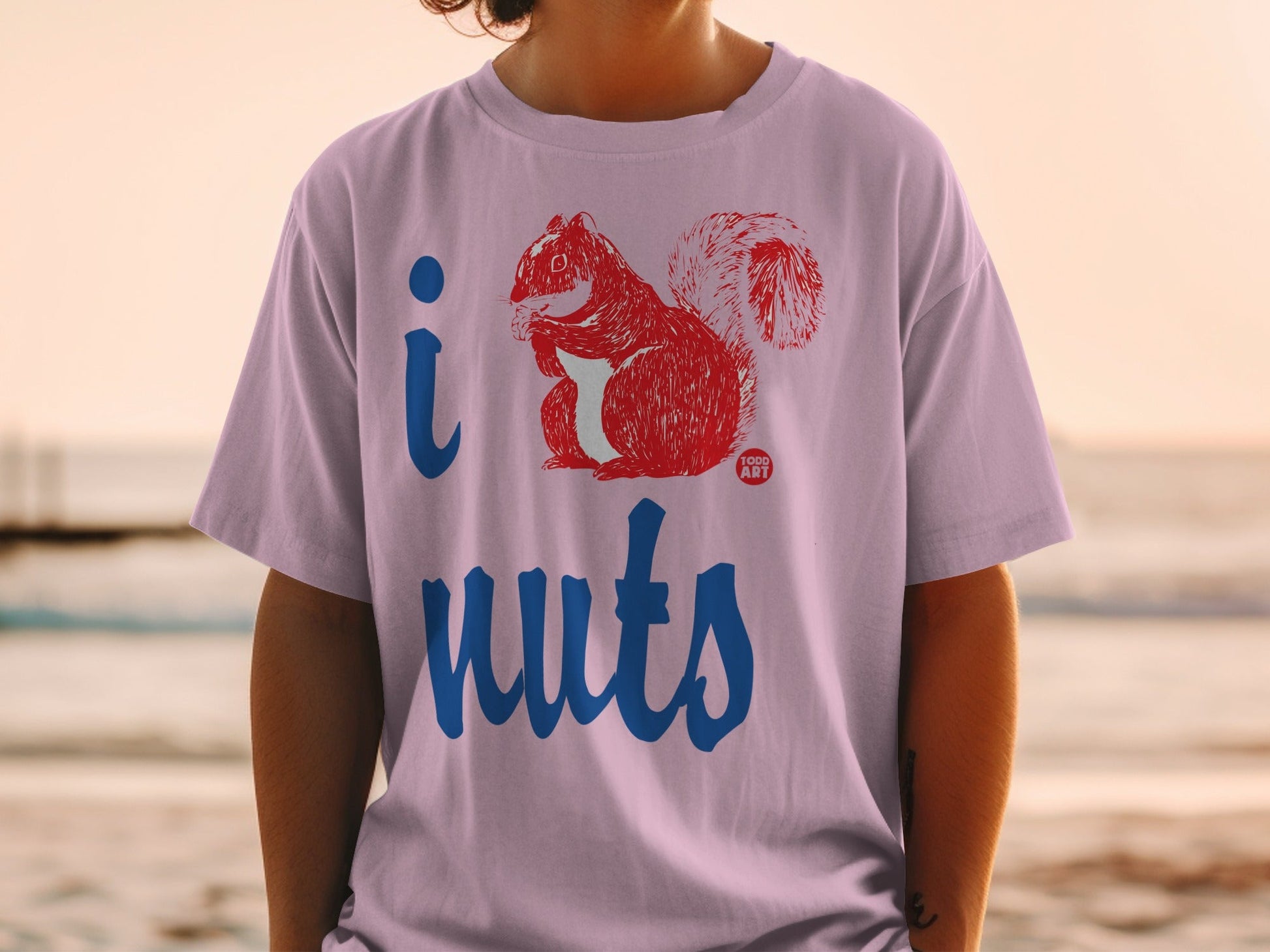 Lilac t-shirt with "I love nuts" graphic featuring a red squirrel.