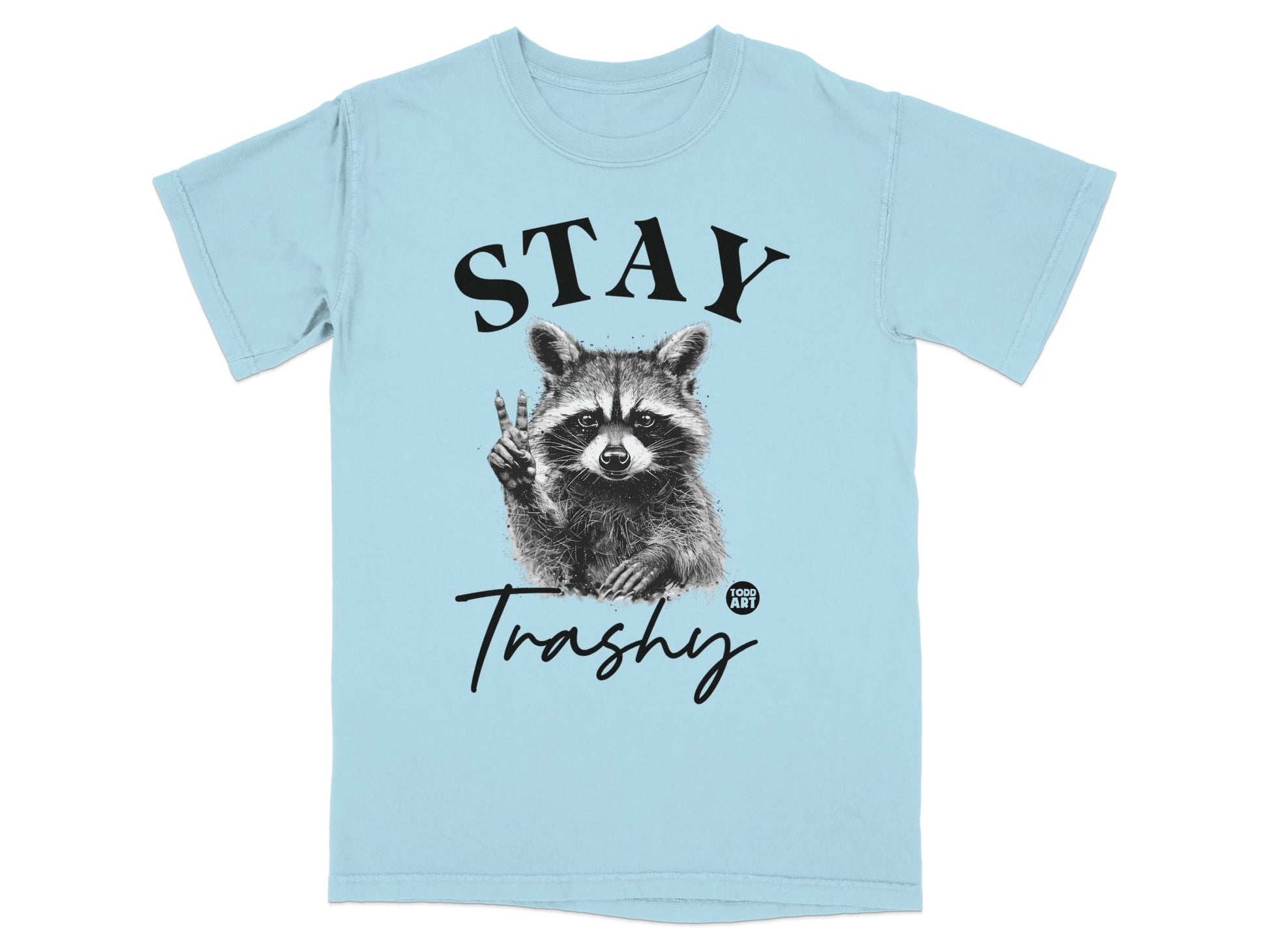 Light blue t-shirt with "STAY Trashy" and a raccoon giving a peace sign.