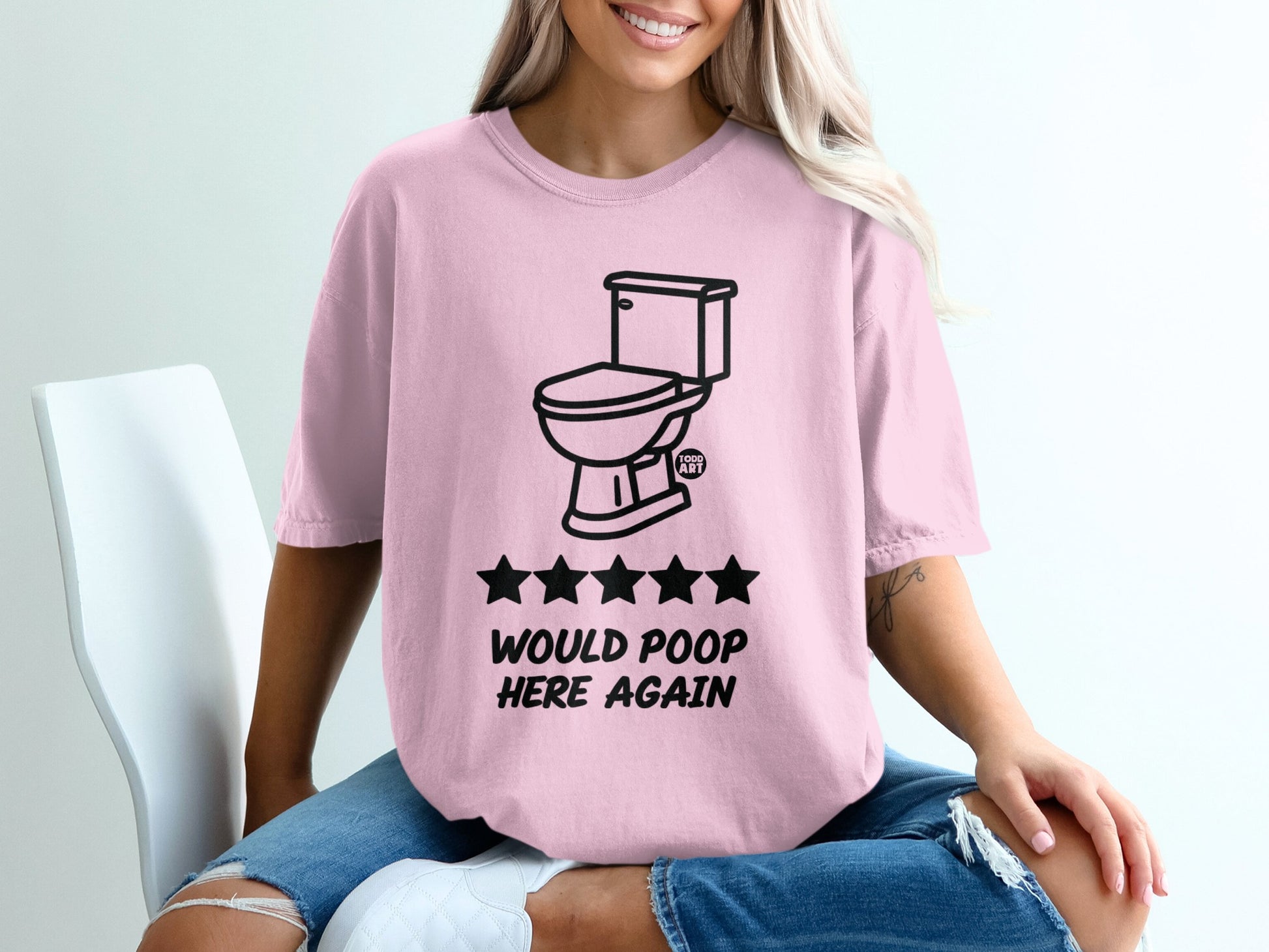 Pink t-shirt with toilet graphic and "Would poop here again" text.