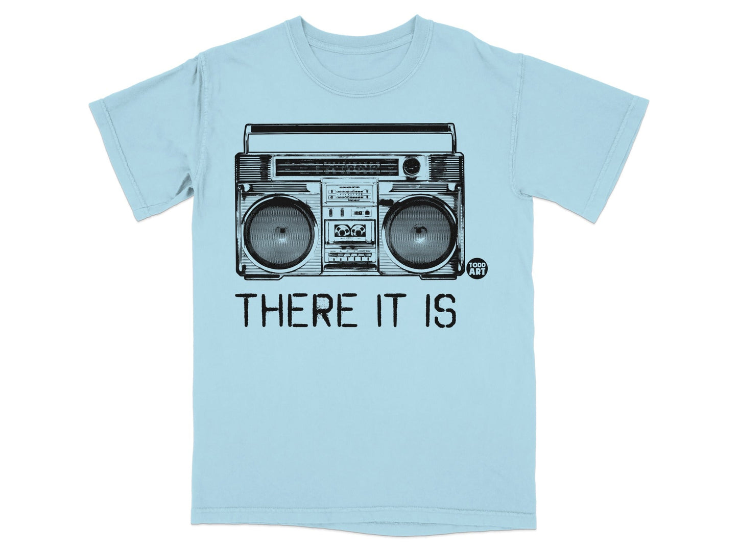 Light blue t-shirt with a black graphic of a boombox and the text "THERE IT IS".