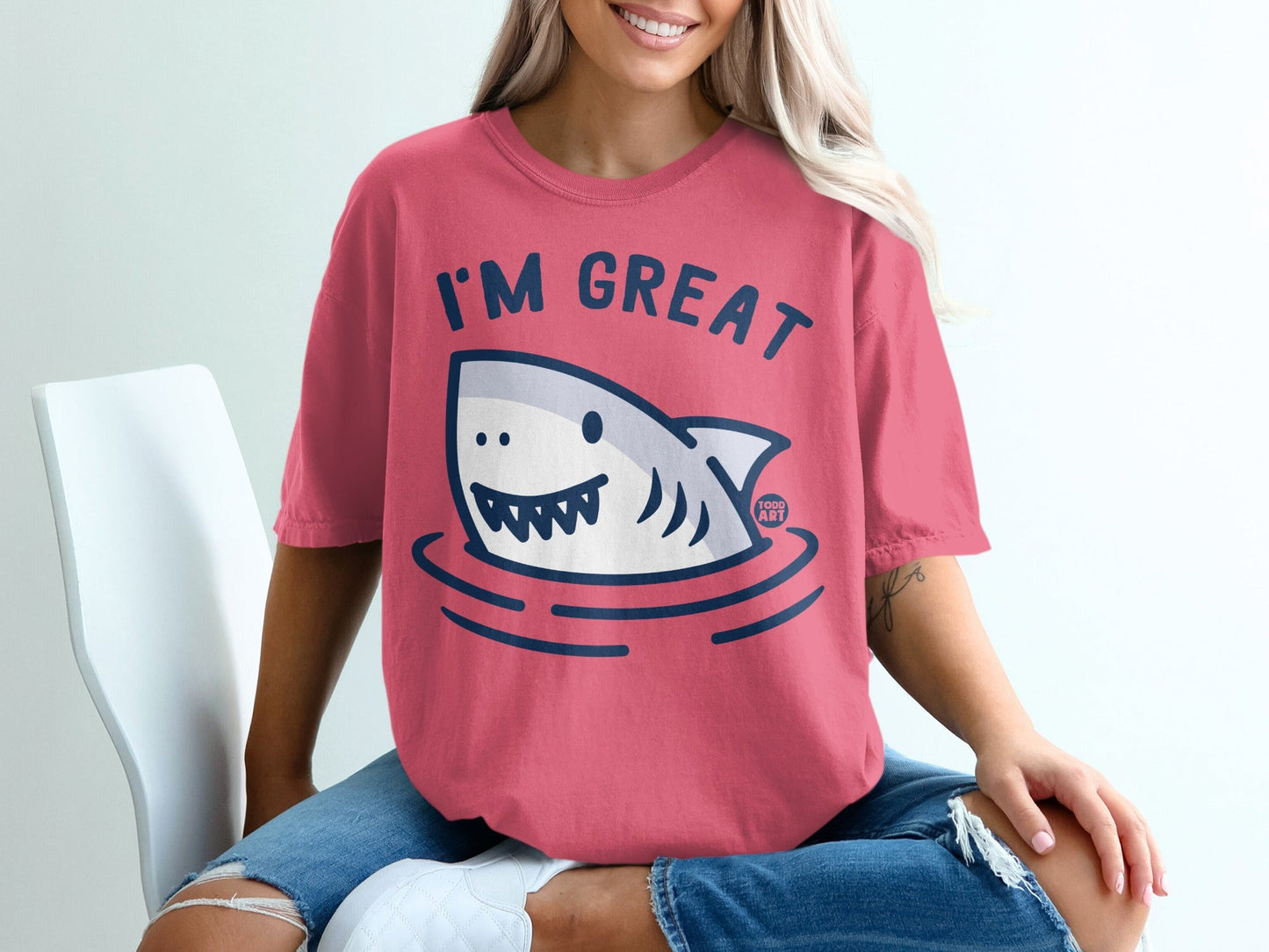 Pink t-shirt with a cartoon shark and "I'M GREAT" text.