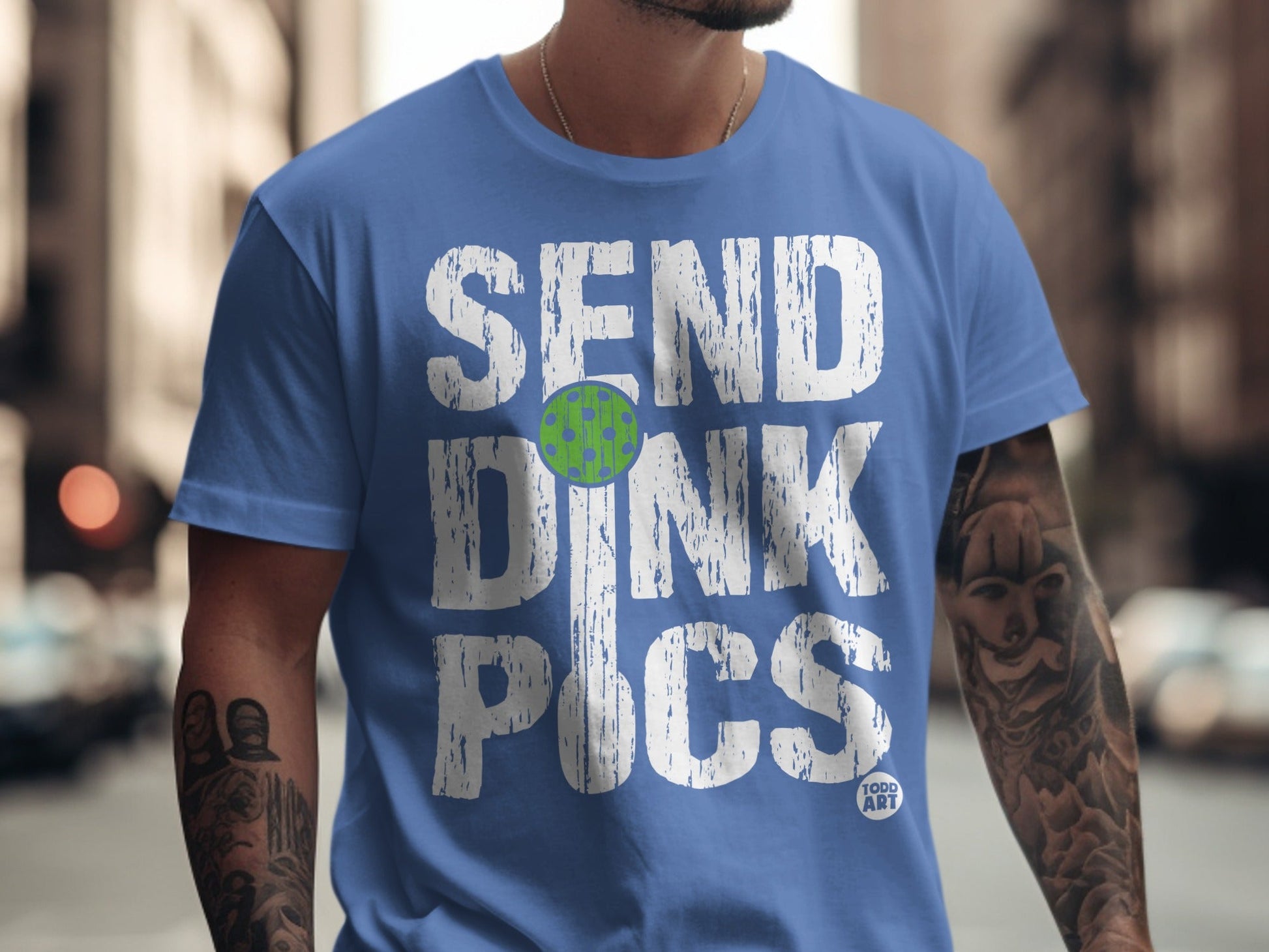 Blue t-shirt with "SEND DINK PICS" and a pickleball graphic.