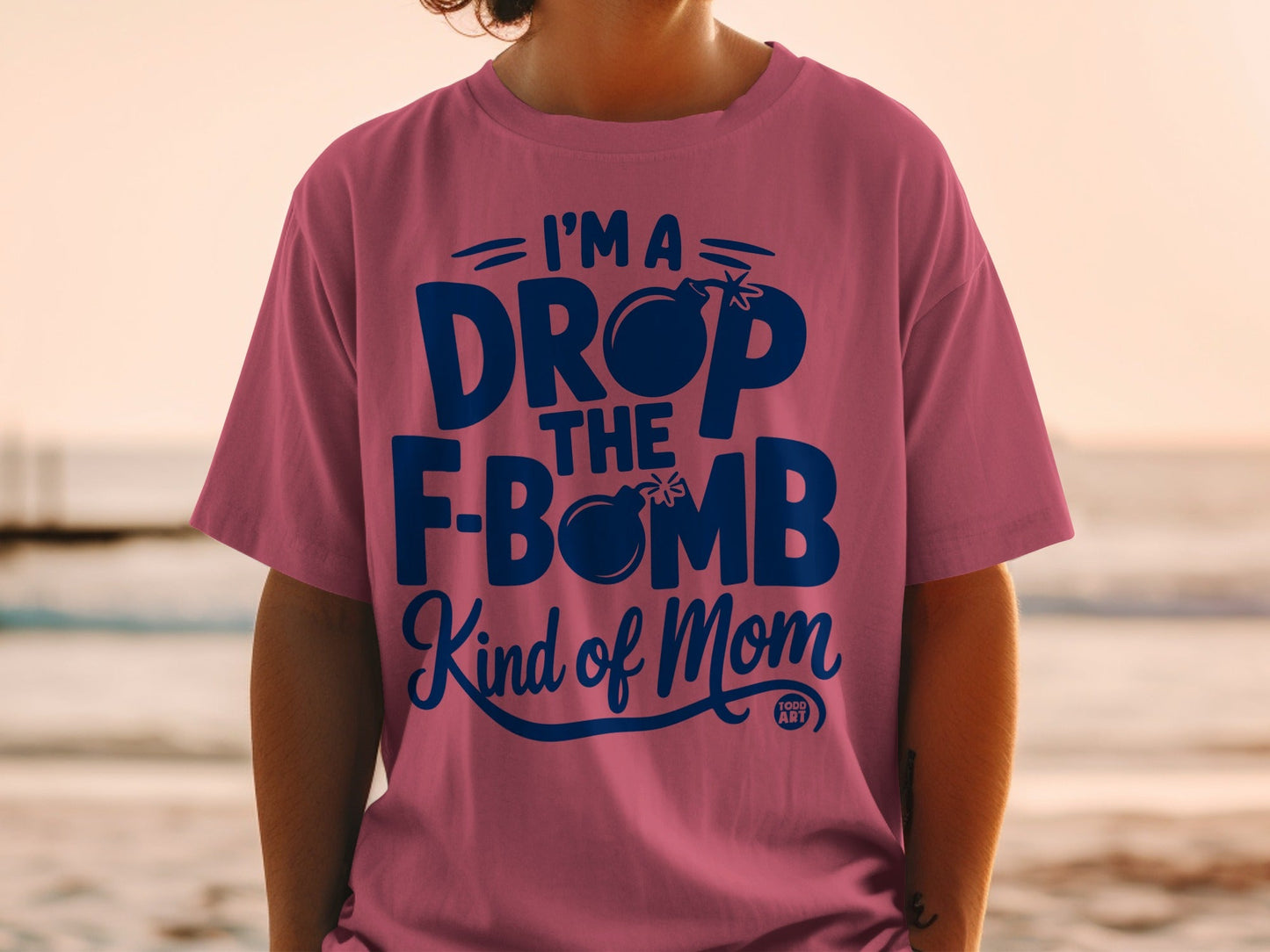 "I'm a drop the f-bomb kind of mom" text on a pink t-shirt.