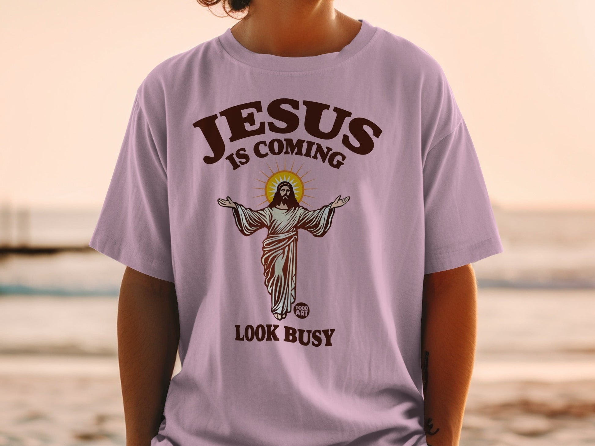 Purple t-shirt with Jesus graphic and "LOOK BUSY" text.