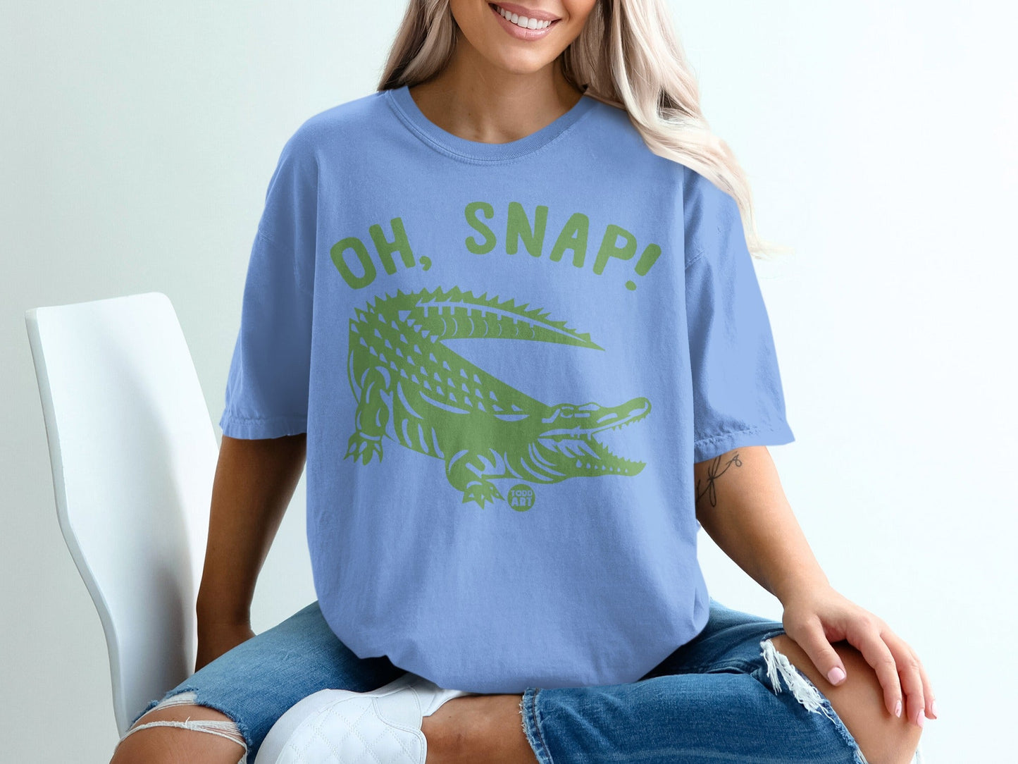 Light blue t-shirt with green "OH, SNAP!" alligator graphic.