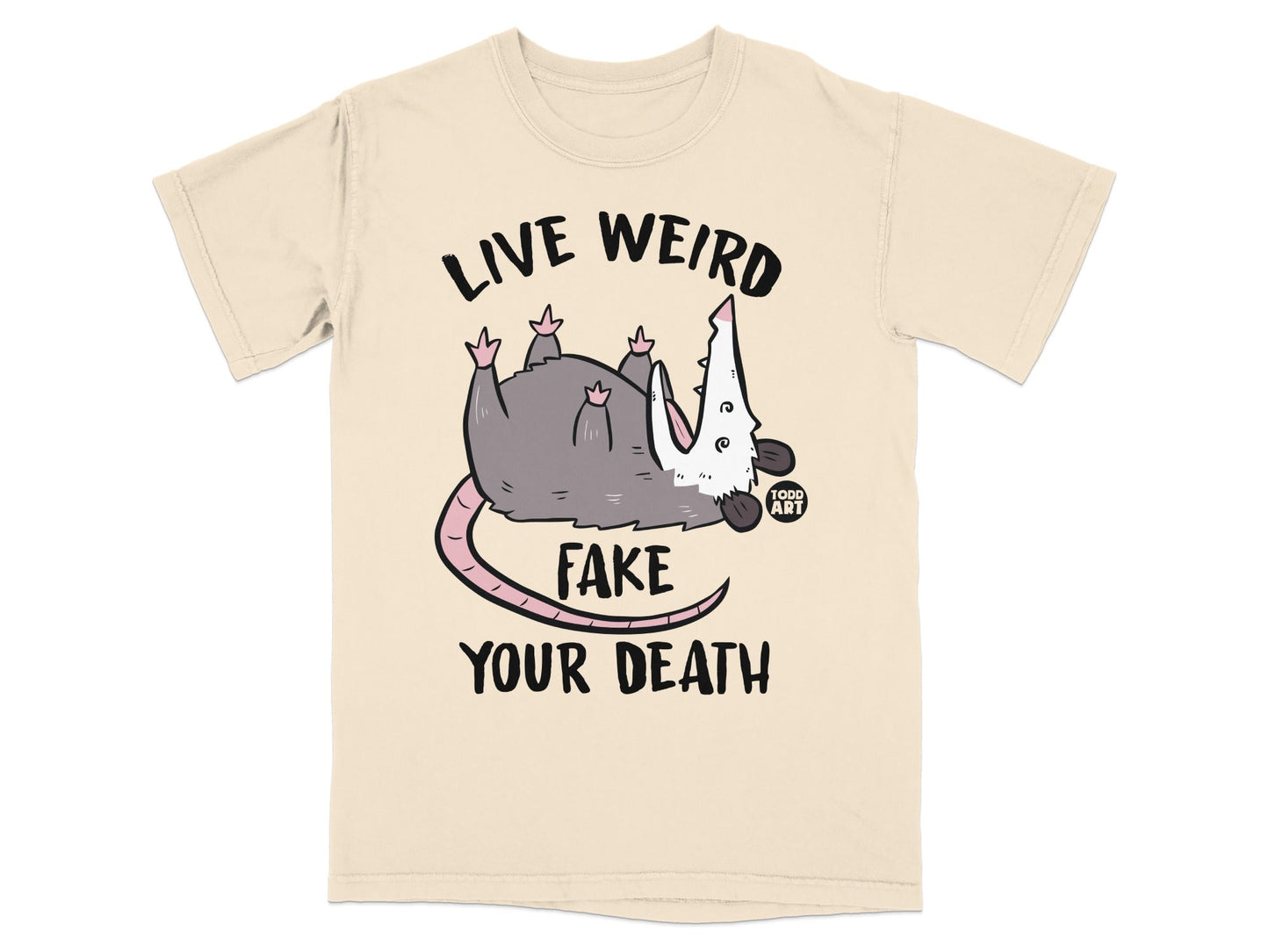 Cream t-shirt with opossum playing dead and text "LIVE WEIRD FAKE YOUR DEATH".