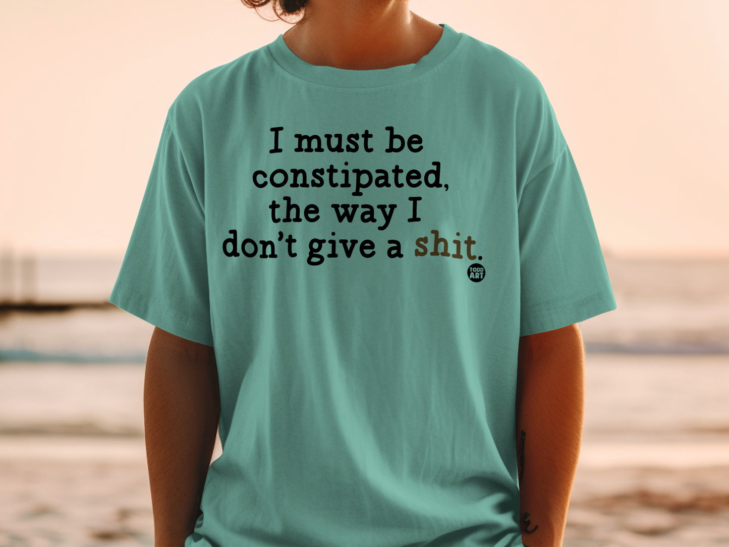 T-shirt with text "I must be constipated, the way I don't give a shit."