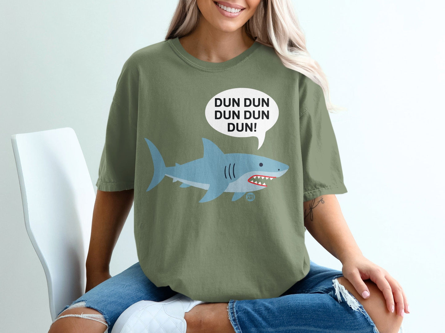 Green t-shirt with a cartoon shark and "DUN DUN DUN DUN!" speech bubble.