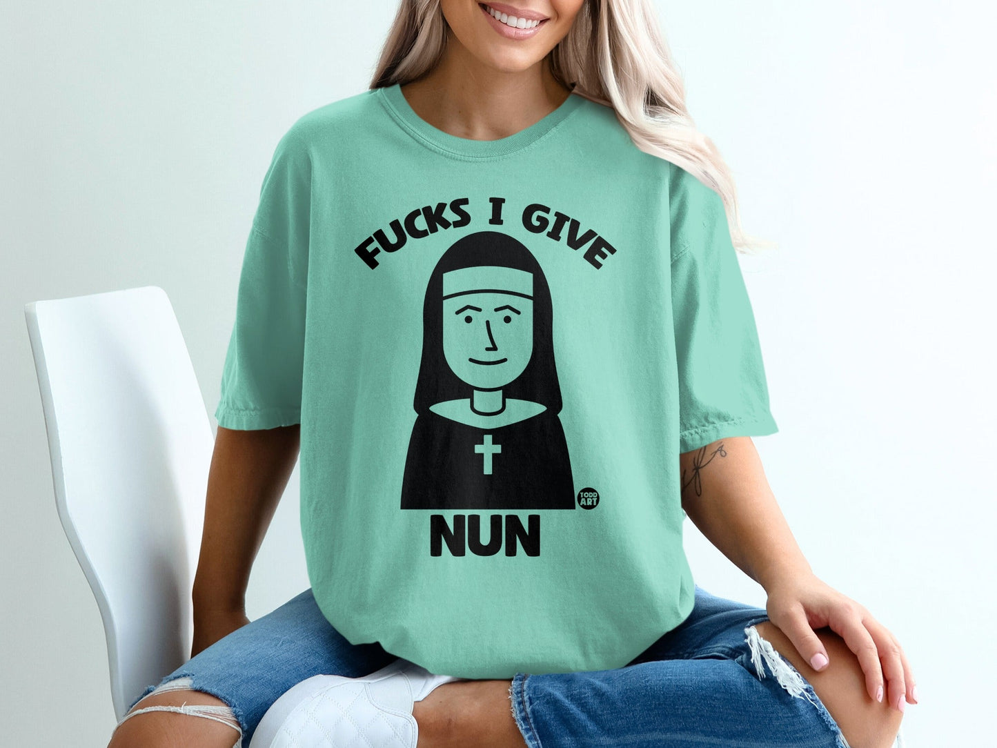Mint t-shirt with a nun graphic and "Fucks I Give" text.