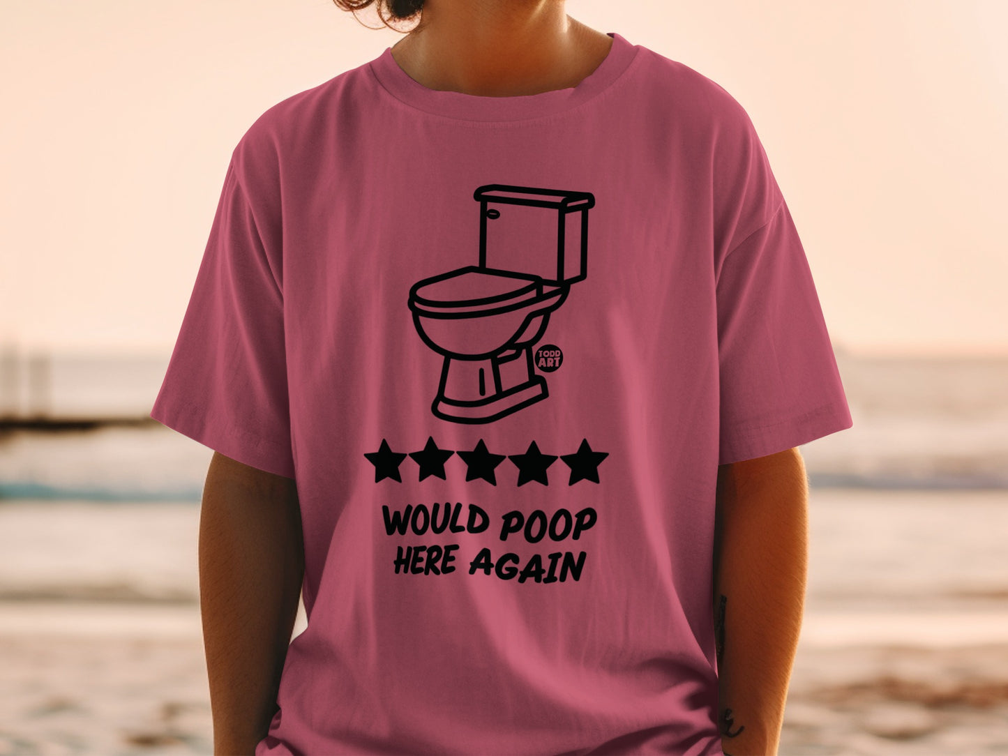 Pink t-shirt with toilet and five stars, "Would poop here again" text.
