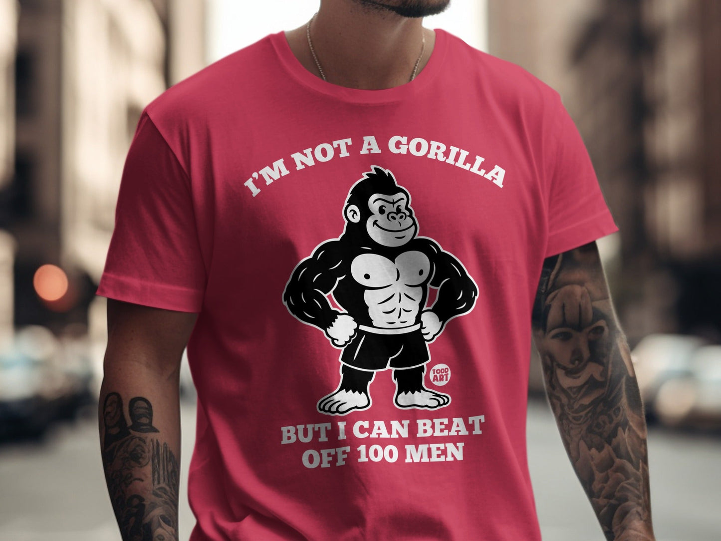 Red t-shirt with gorilla graphic and text "I'M NOT A GORILLA BUT I CAN BEAT OFF 100 MEN".