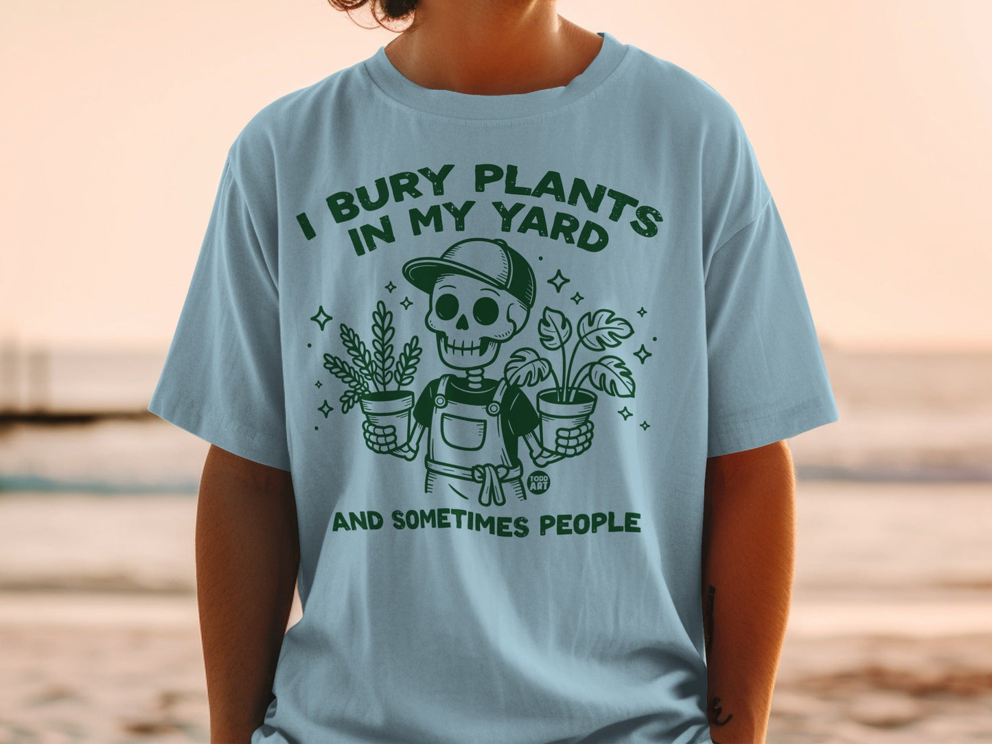 Skeleton burying plants in yard, text reads "I bury plants in my yard and sometimes people".