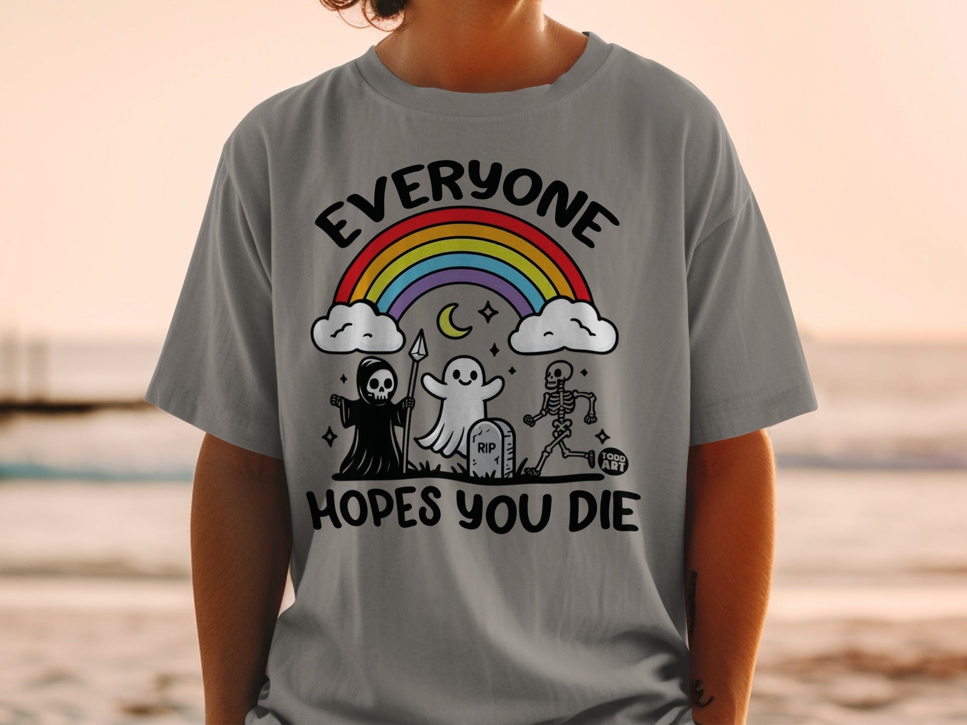 Grey t-shirt with Grim Reaper, ghost, skeleton, and rainbow graphic.
