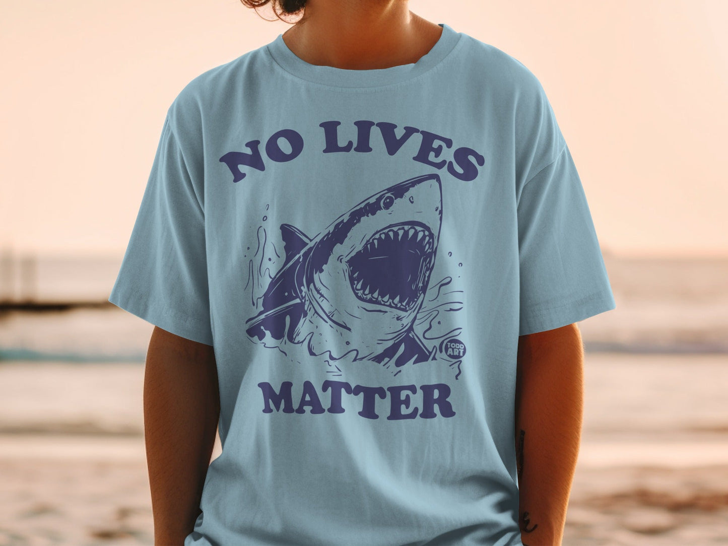 T-shirt with a graphic of a shark with the text "NO LIVES MATTER"