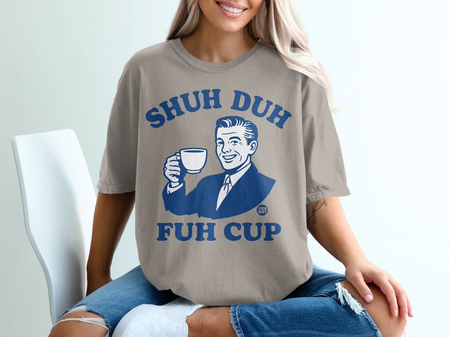 T-shirt with "SHUH DUH FUH CUP" text and retro man holding coffee cup.
