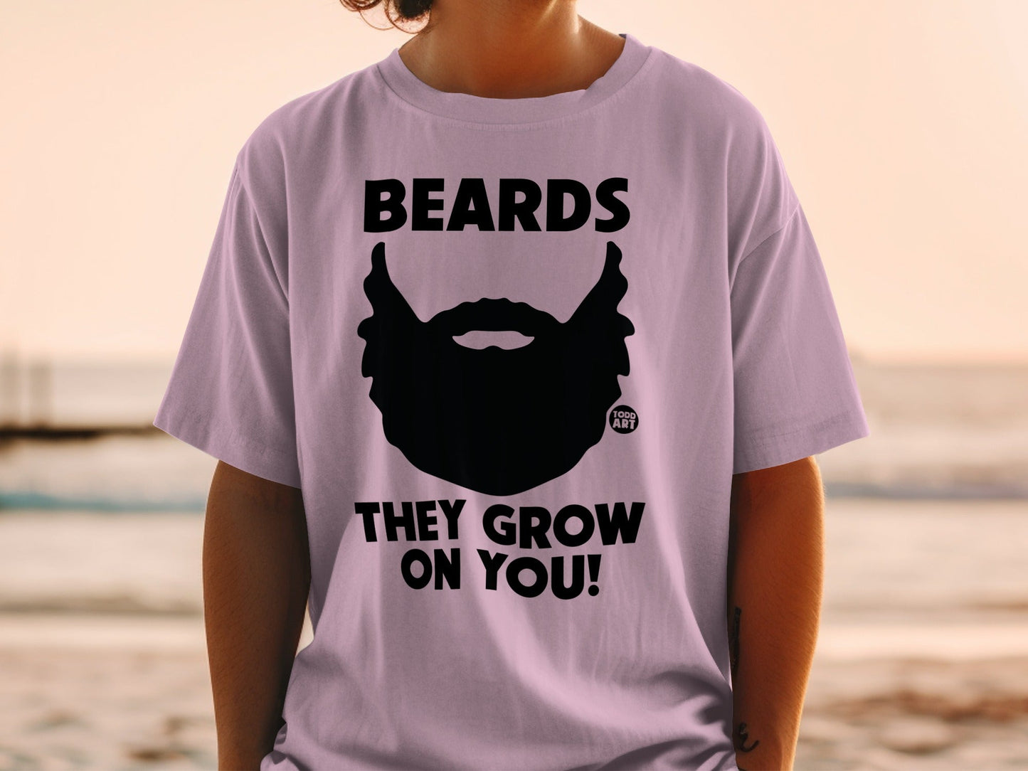 Purple t-shirt with a black beard graphic and text "BEARDS THEY GROW ON YOU!".