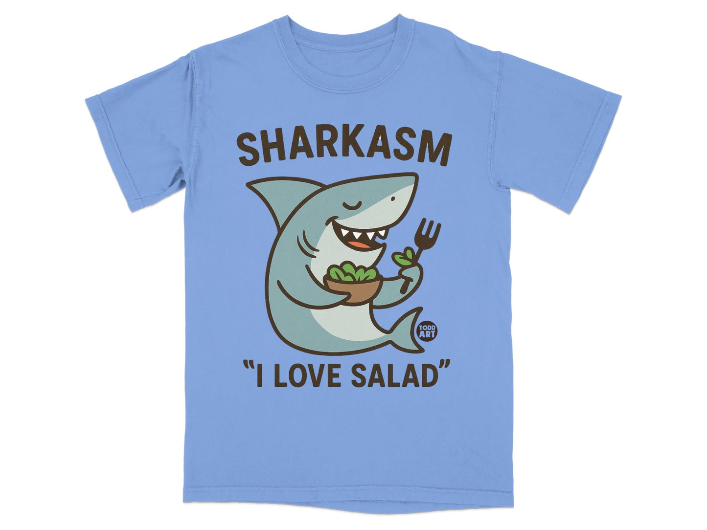 Shark wearing shirt saying "Sharkasm I Love Salad" holding salad.