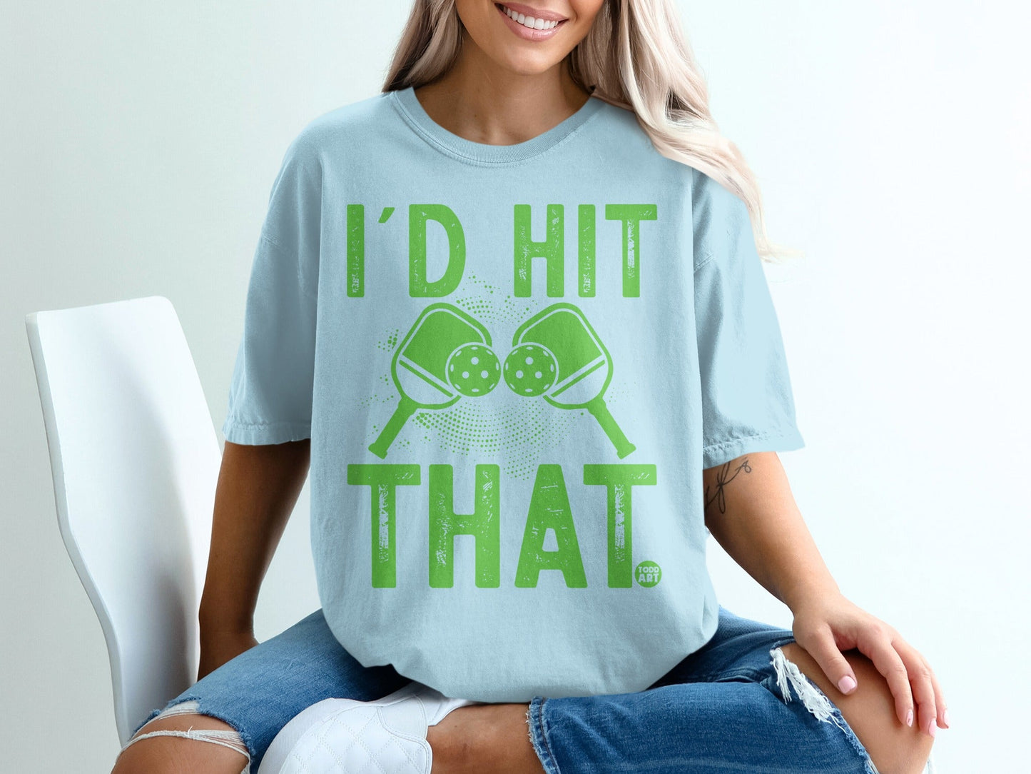 Light blue t-shirt with "I'd Hit That" and pickleball paddles graphic.