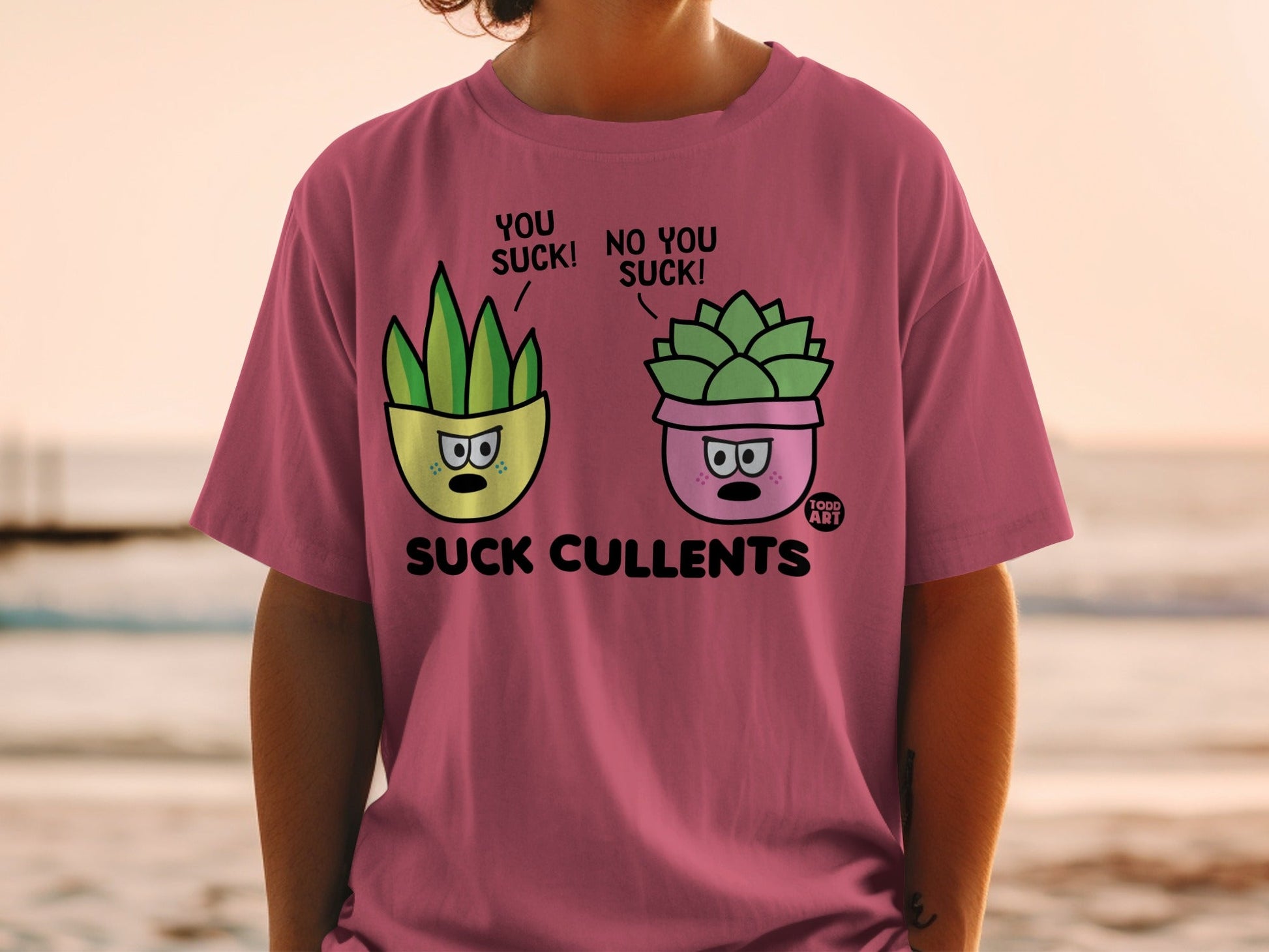 T-shirt with cartoon succulent plants saying "You suck!" and "No you suck!".
