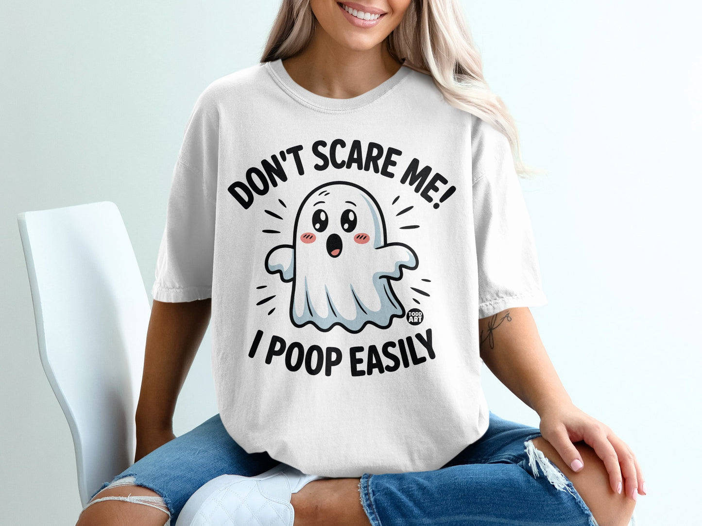 T-shirt with "DON'T SCARE ME! I POOP EASILY" and a cartoon ghost.