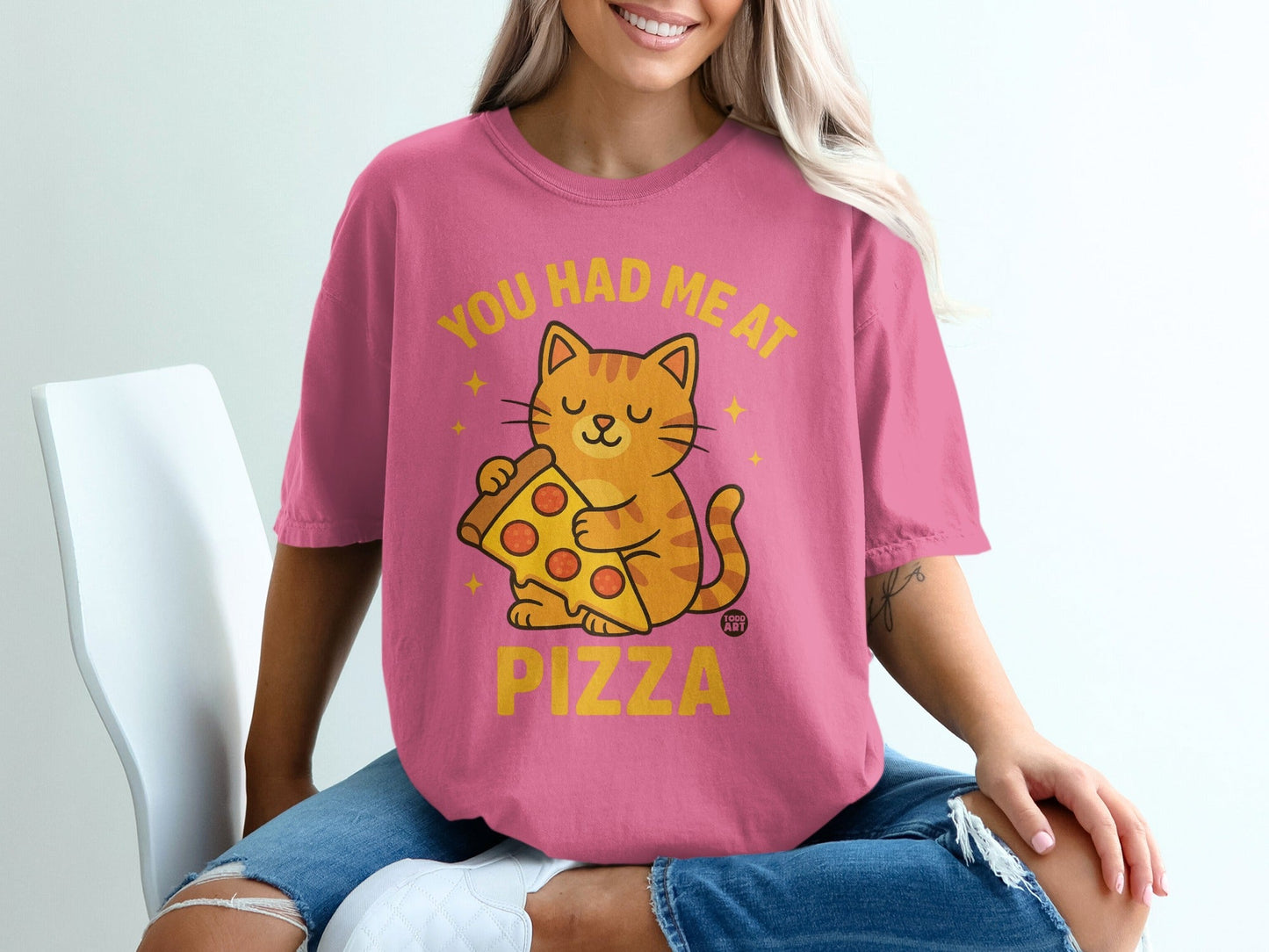 Pink t-shirt with cat eating pizza and text "YOU HAD ME AT PIZZA".