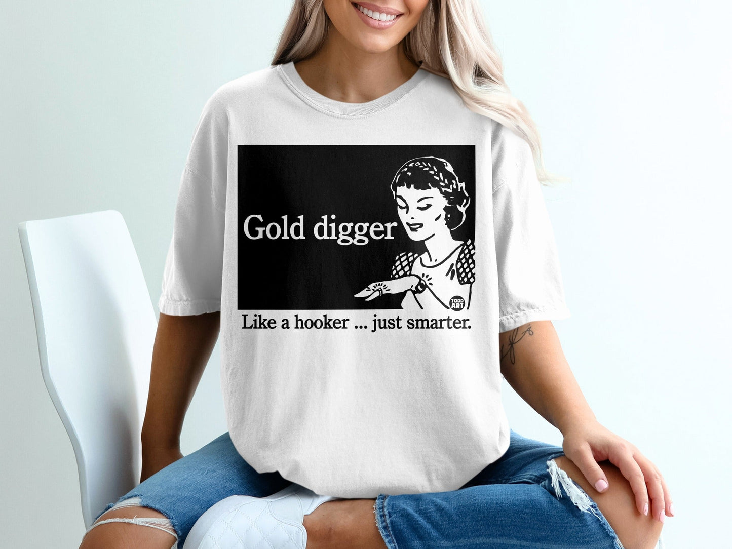 White t-shirt with "Gold digger" graphic and caption "Like a hooker... just smarter."
