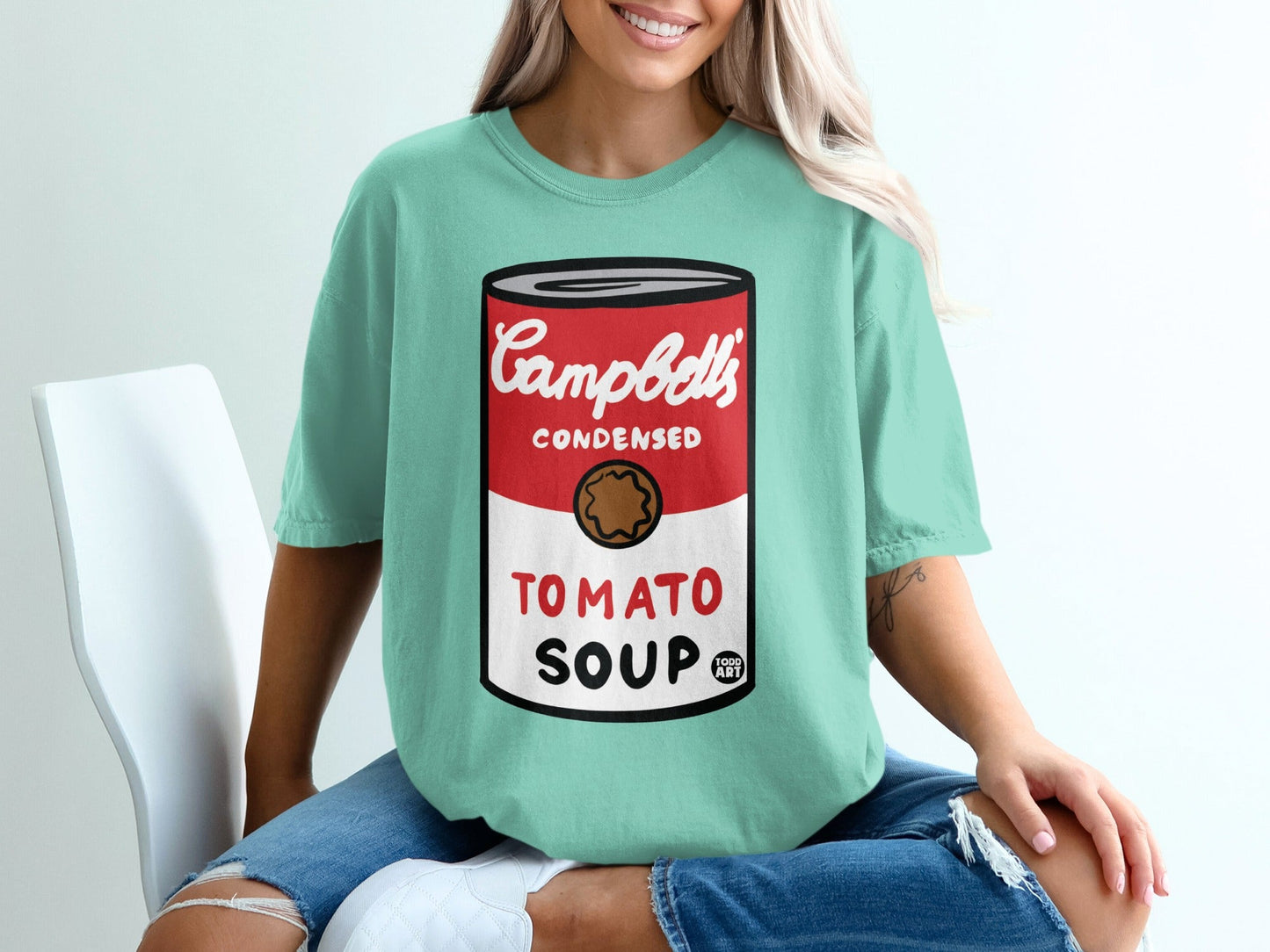 Teal t-shirt with Campbell's Condensed Tomato Soup logo.