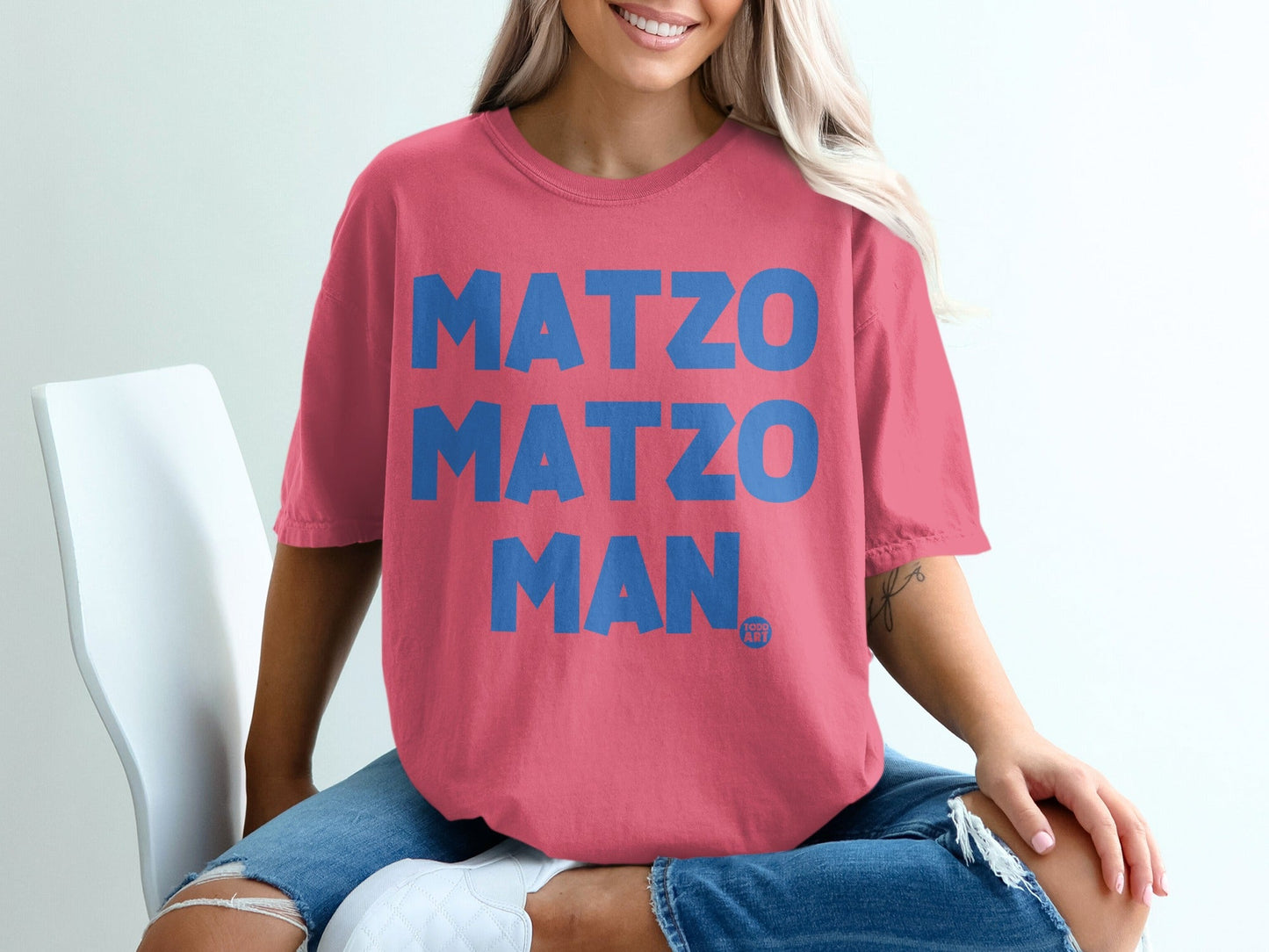 Pink t-shirt with "MATZO MATZO MAN" in large blue letters.