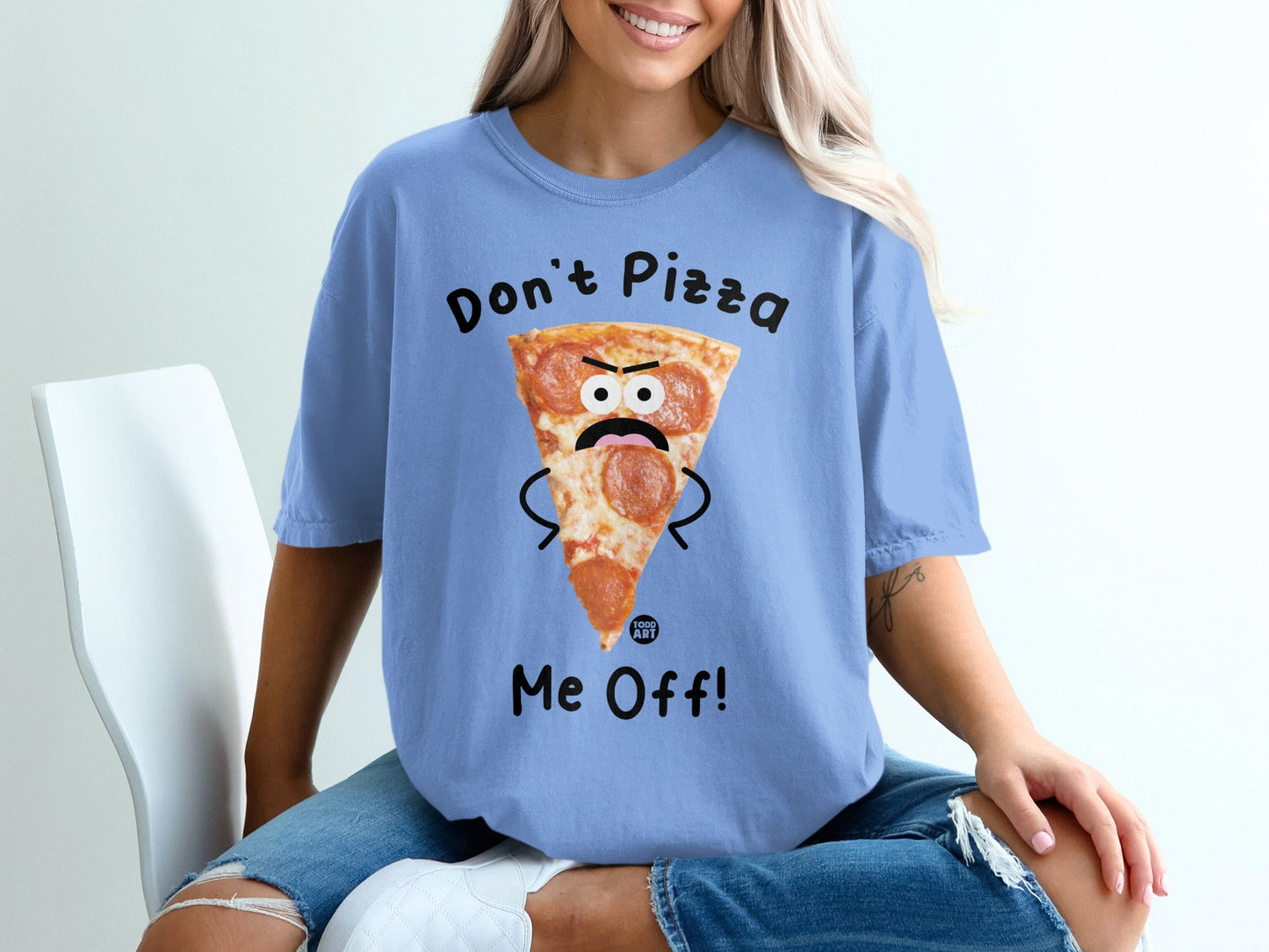 Blue t-shirt with a cartoon pizza slice saying "Don't Pizza Me Off!"