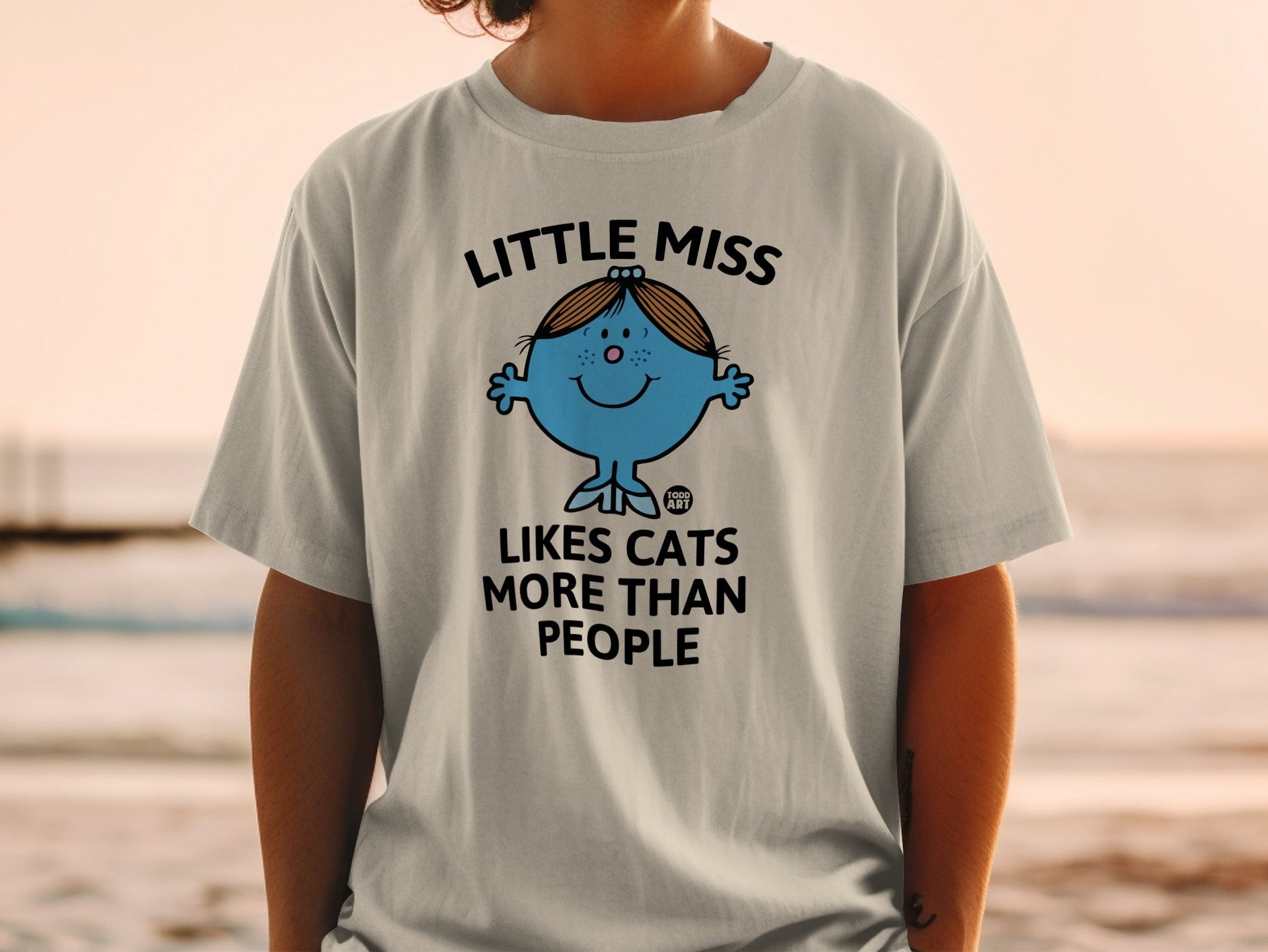 Little Miss character with "Loves Cats More Than People" text on a t-shirt.