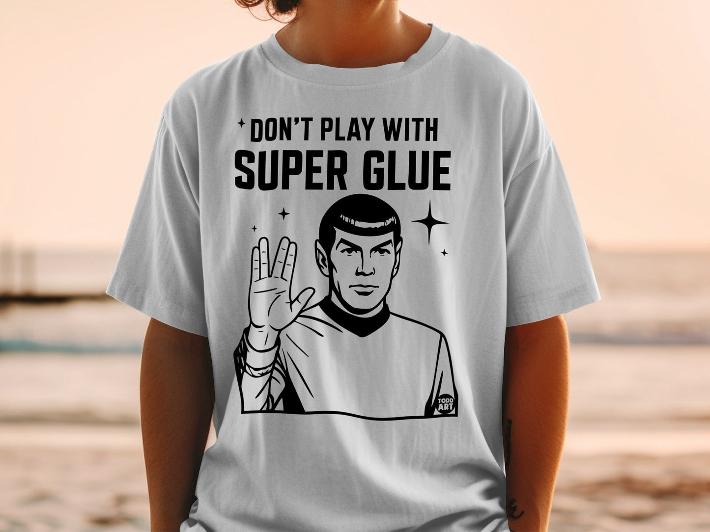 White t-shirt with "Don't Play with Super Glue" and Spock illustration.