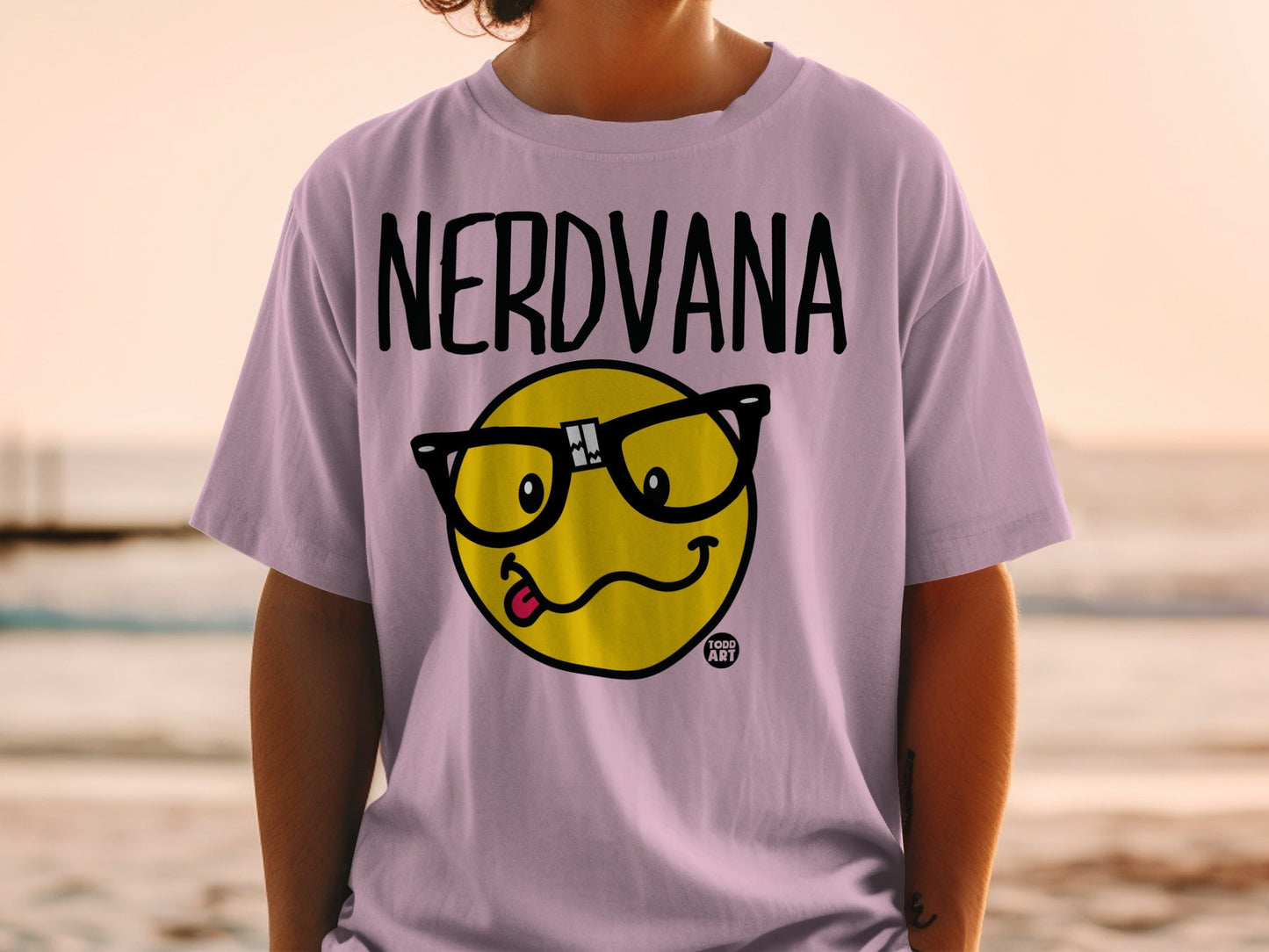 Pink t-shirt with "NERDVANA" text and yellow smiley face with glasses.