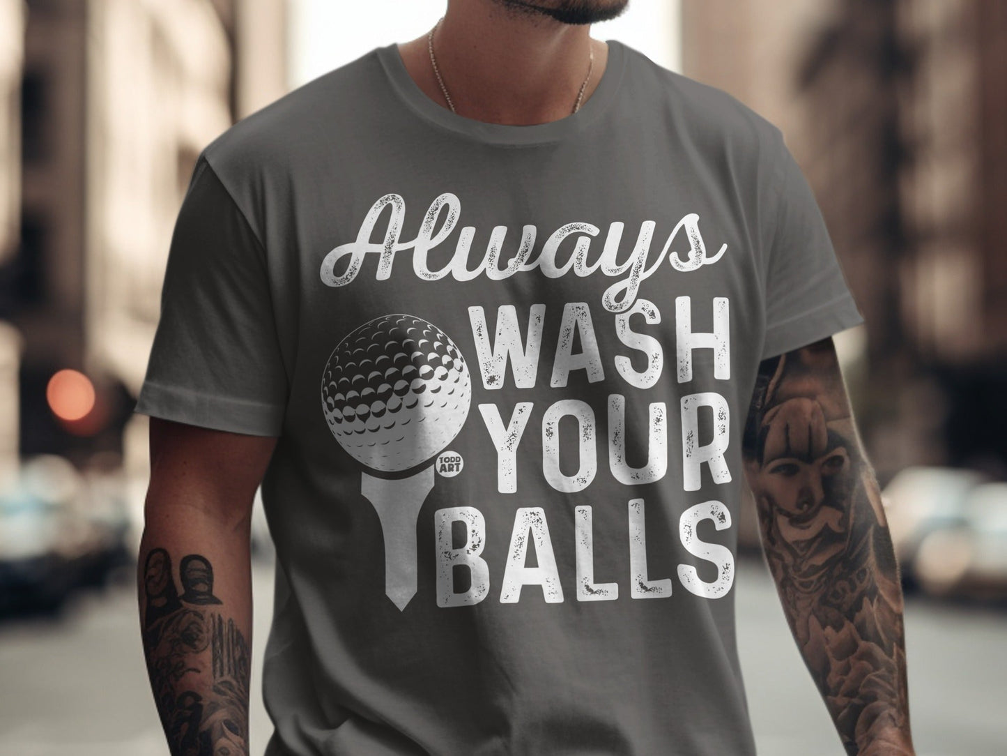 Grey t-shirt with "Always Wash Your Balls" text and golf ball graphic.