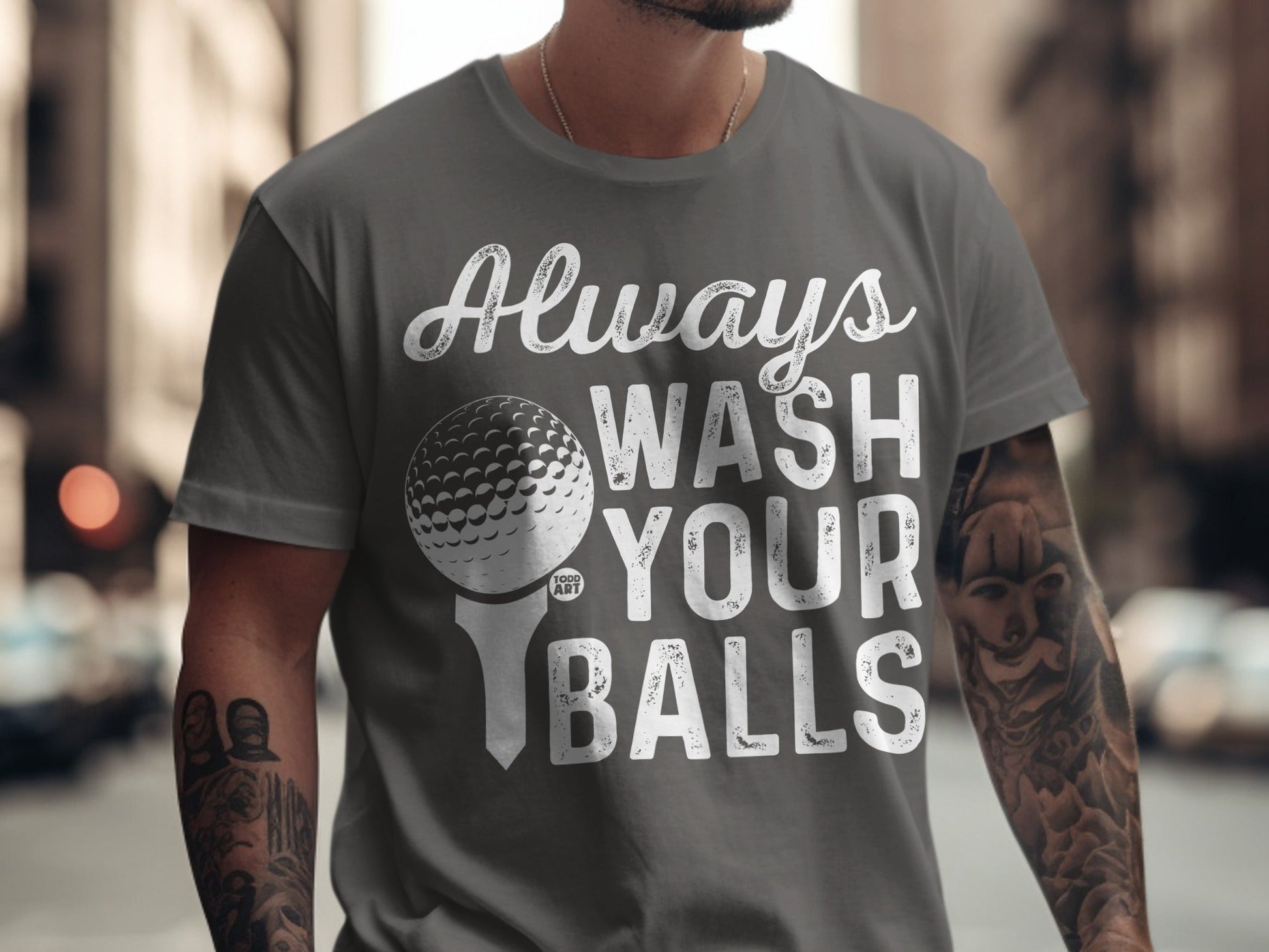 Grey t-shirt with "Always Wash Your Balls" text and golf ball graphic.