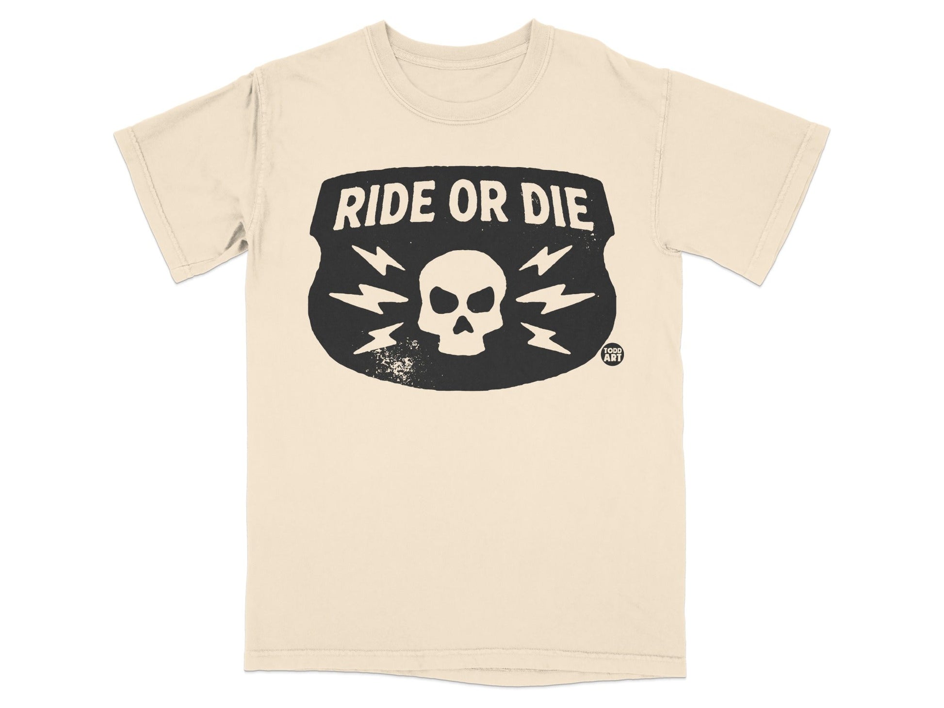 Cream t-shirt with black "RIDE OR DIE" text and skull graphic.