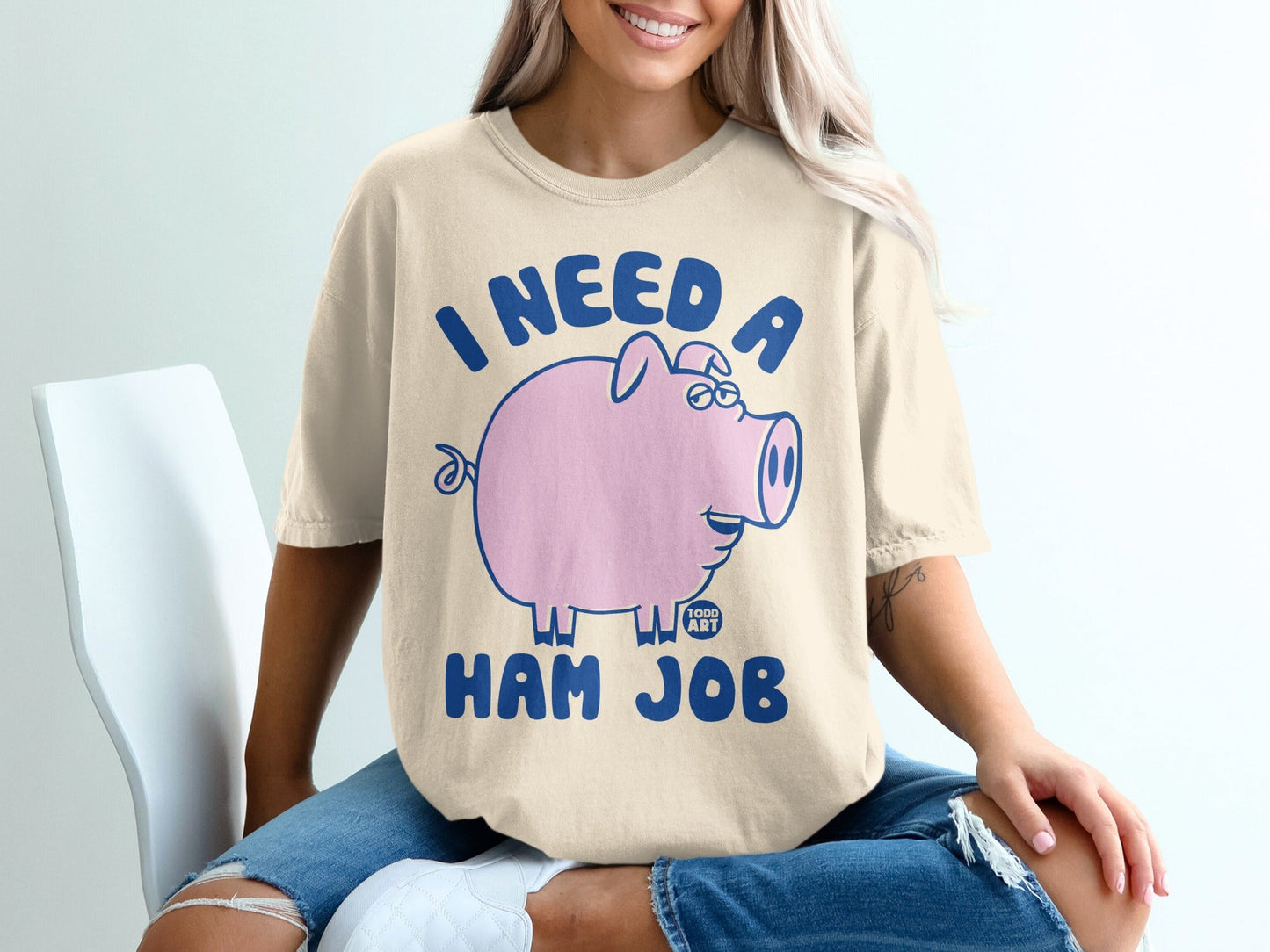 Tan t-shirt with "I NEED A HAM JOB" and a pink pig illustration.