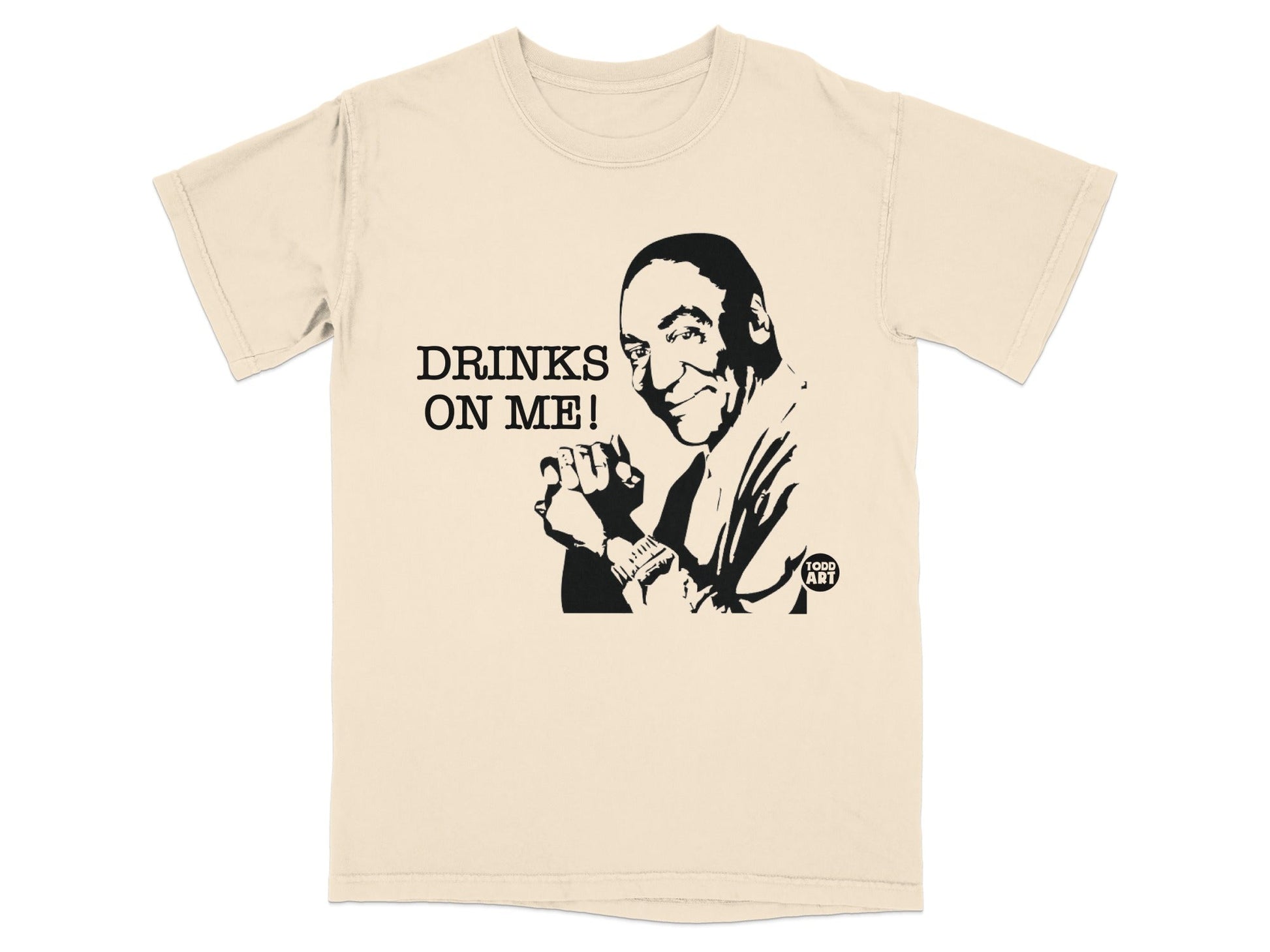 Cream t-shirt with black graphic of Bill Cosby and "DRINKS ON ME!" text.