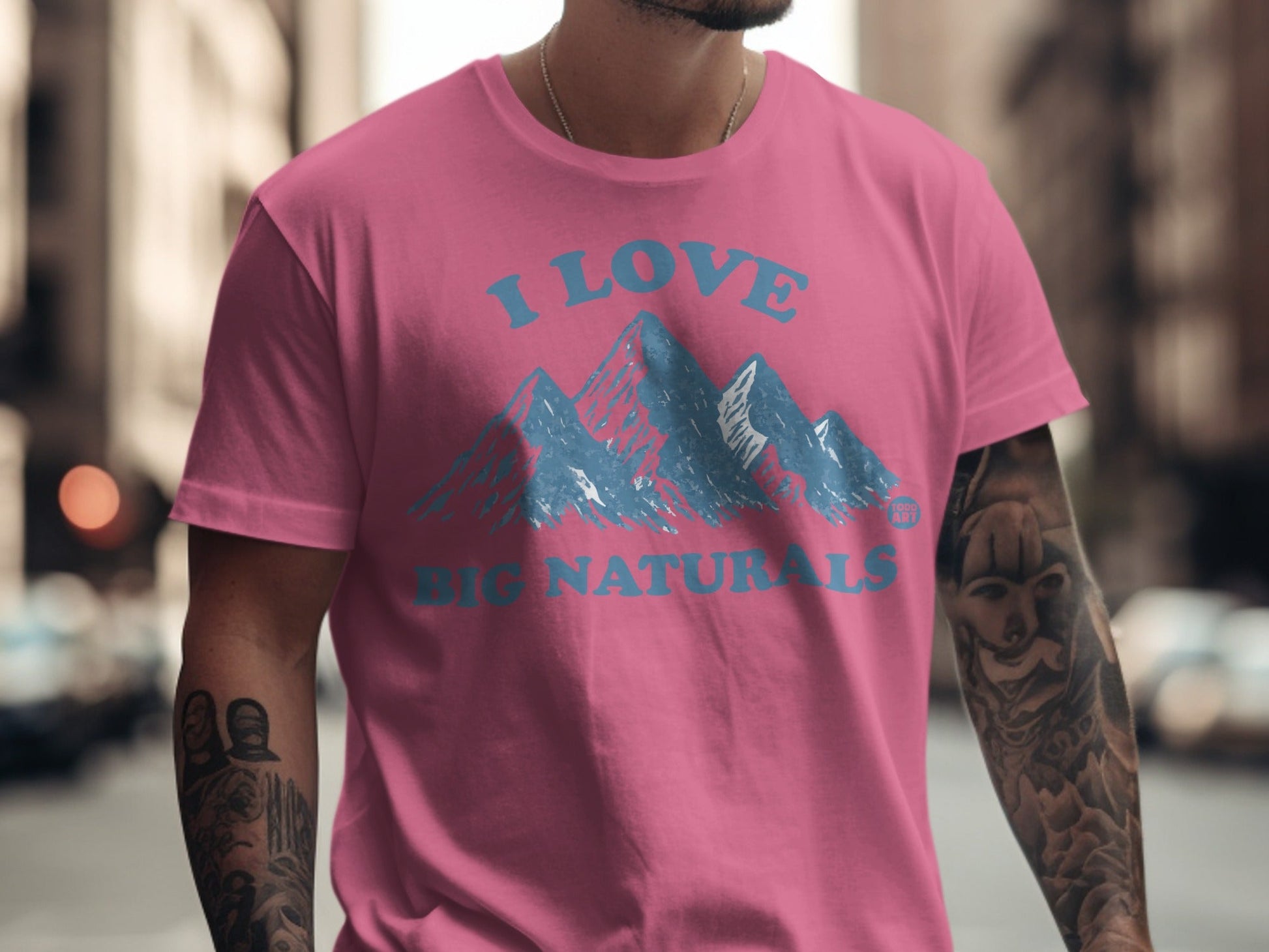 Pink t-shirt with "I LOVE BIG NATURALS" and blue mountain graphic.