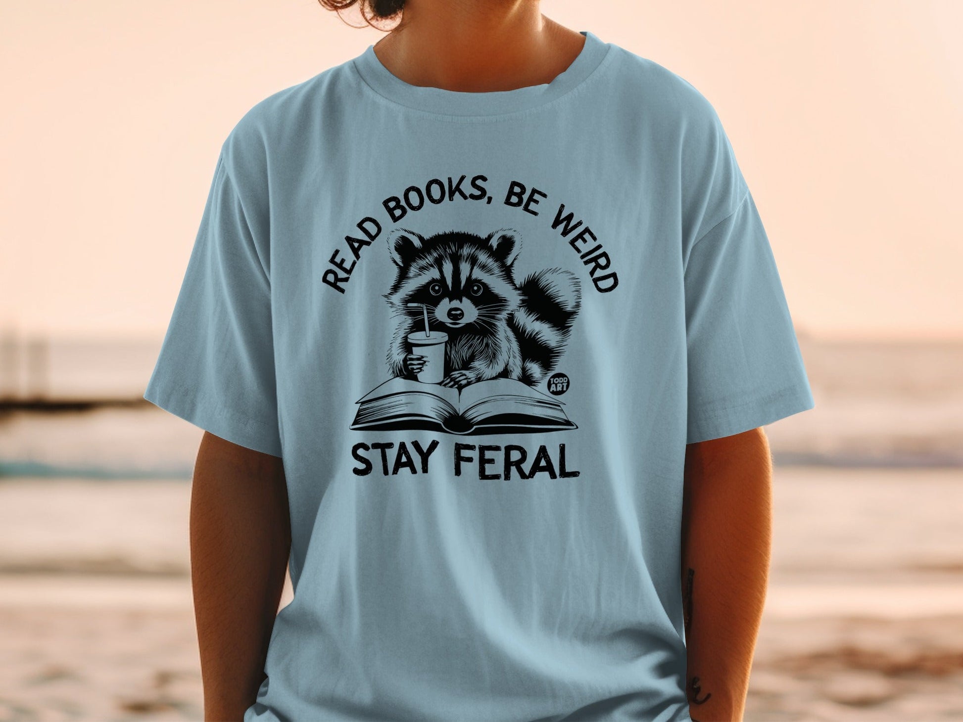 Read Books Be Weird Stay Feral Raccoon Graphic Shirt