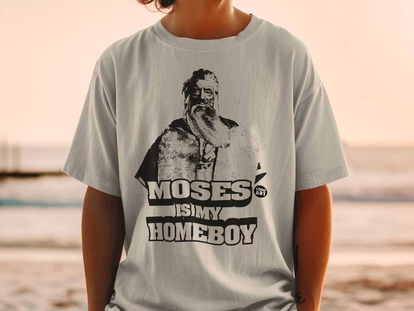 T-shirt with portrait of Moses and text "MOSES IS MY HOMEBOY".